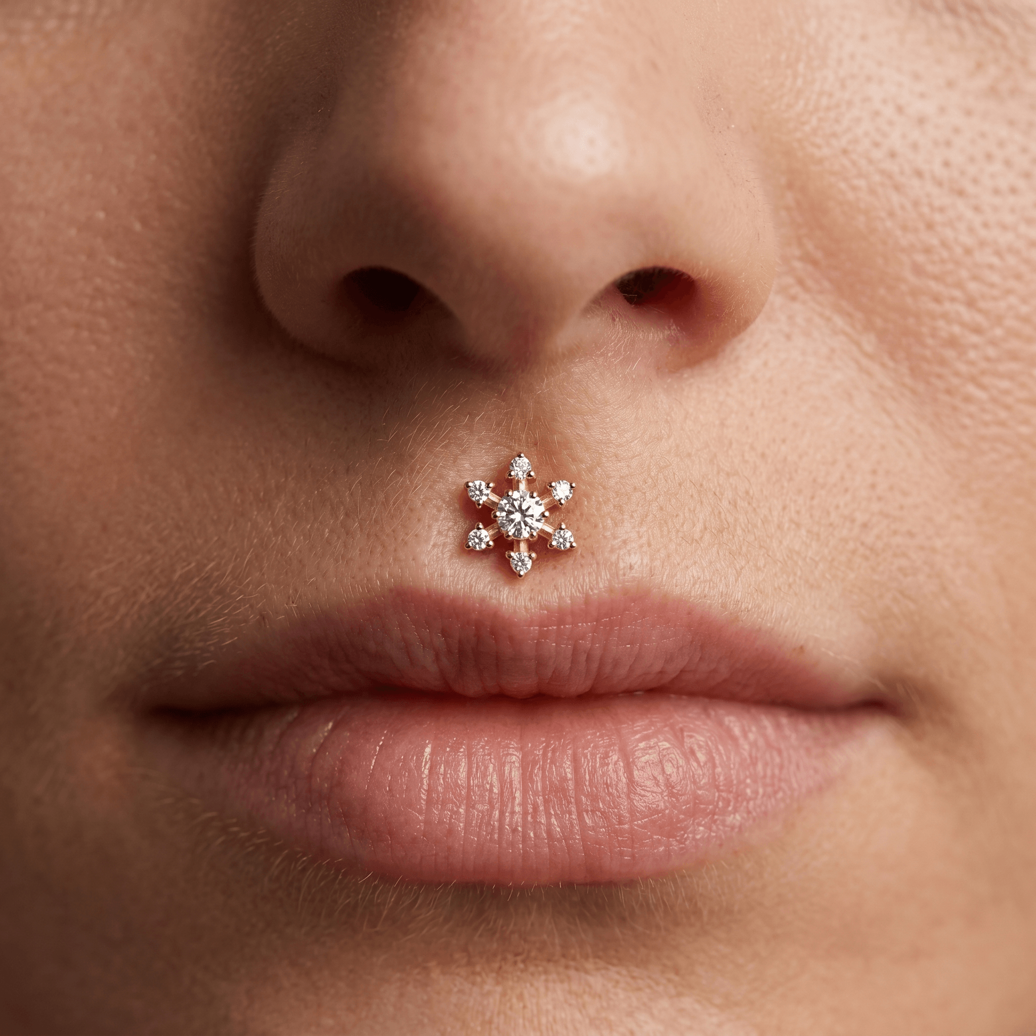 Gold flower zircon stud — piercing placement