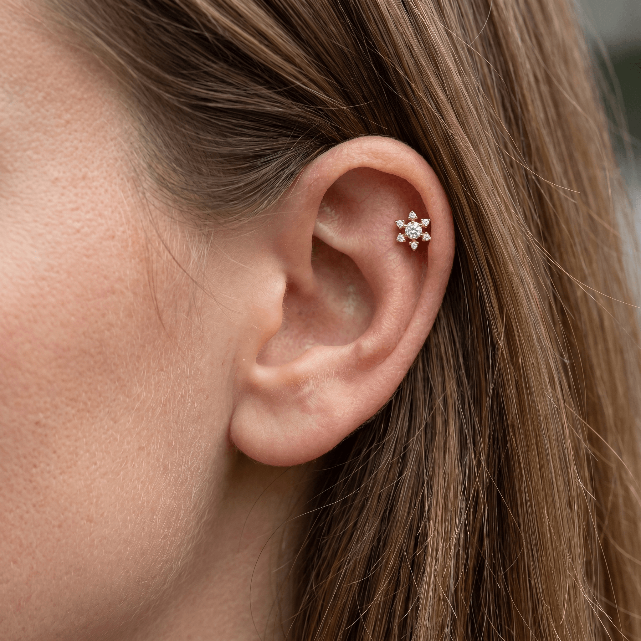 Silver flower zircon stud — piercing placement