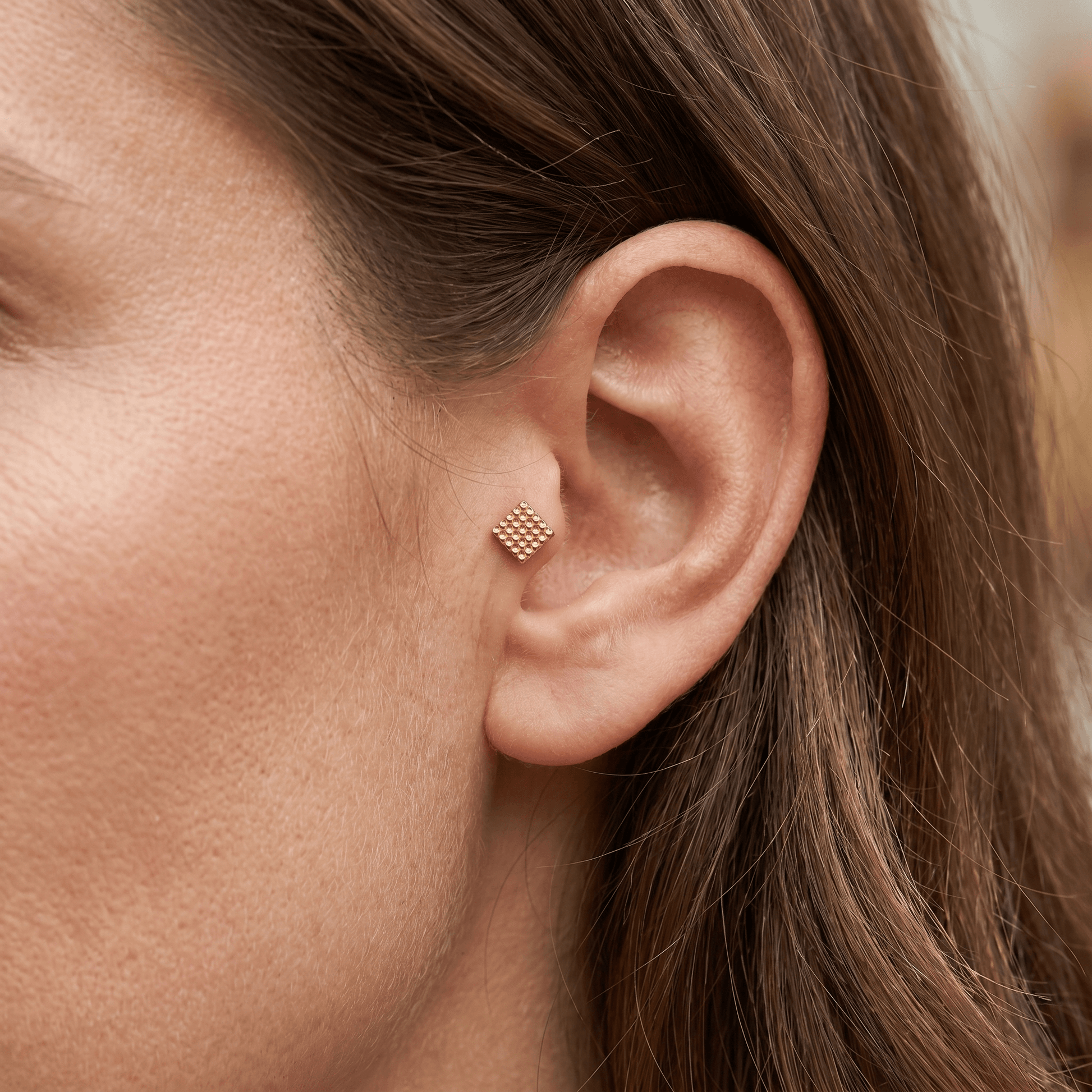 Gold 16g faux piercing jewelry styled gracefully in a .