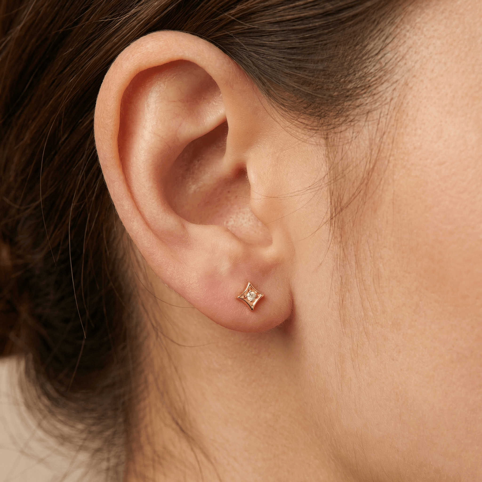Gold medical-grade titanium piercing worn perfectly in a standard .