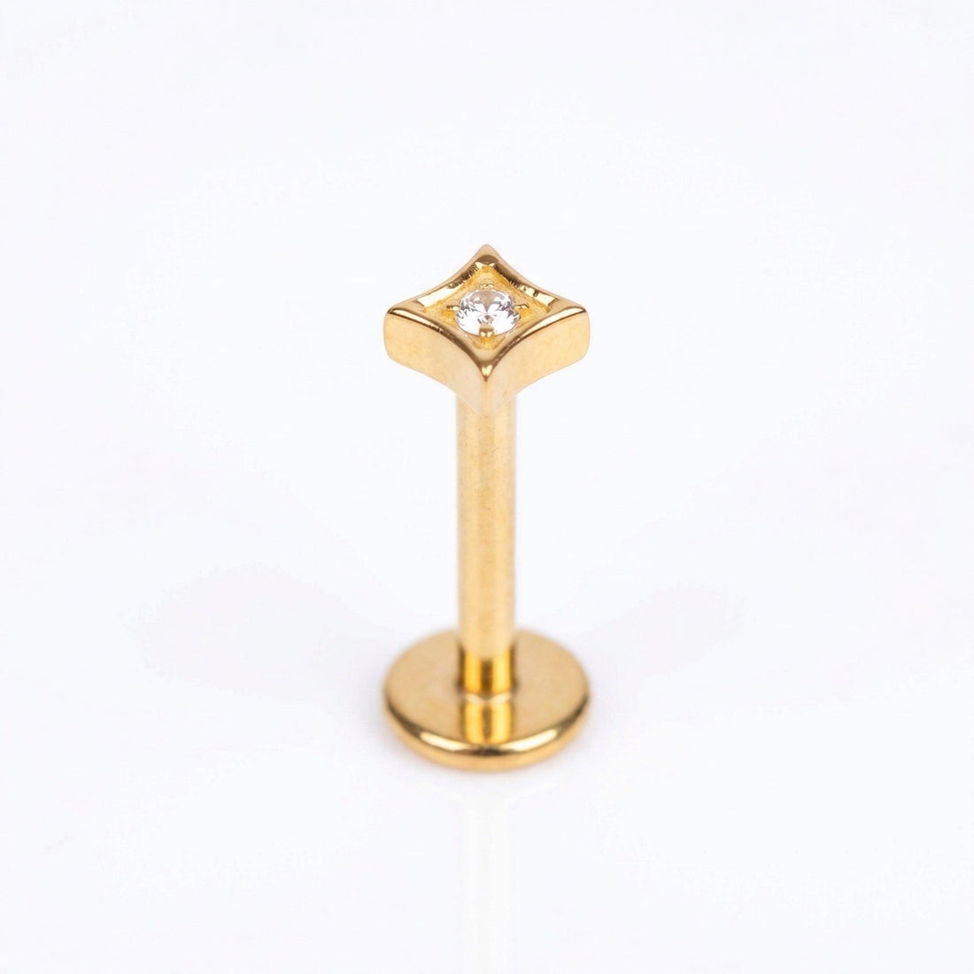 Gold geometric zircon stud — triple helix piercing placement