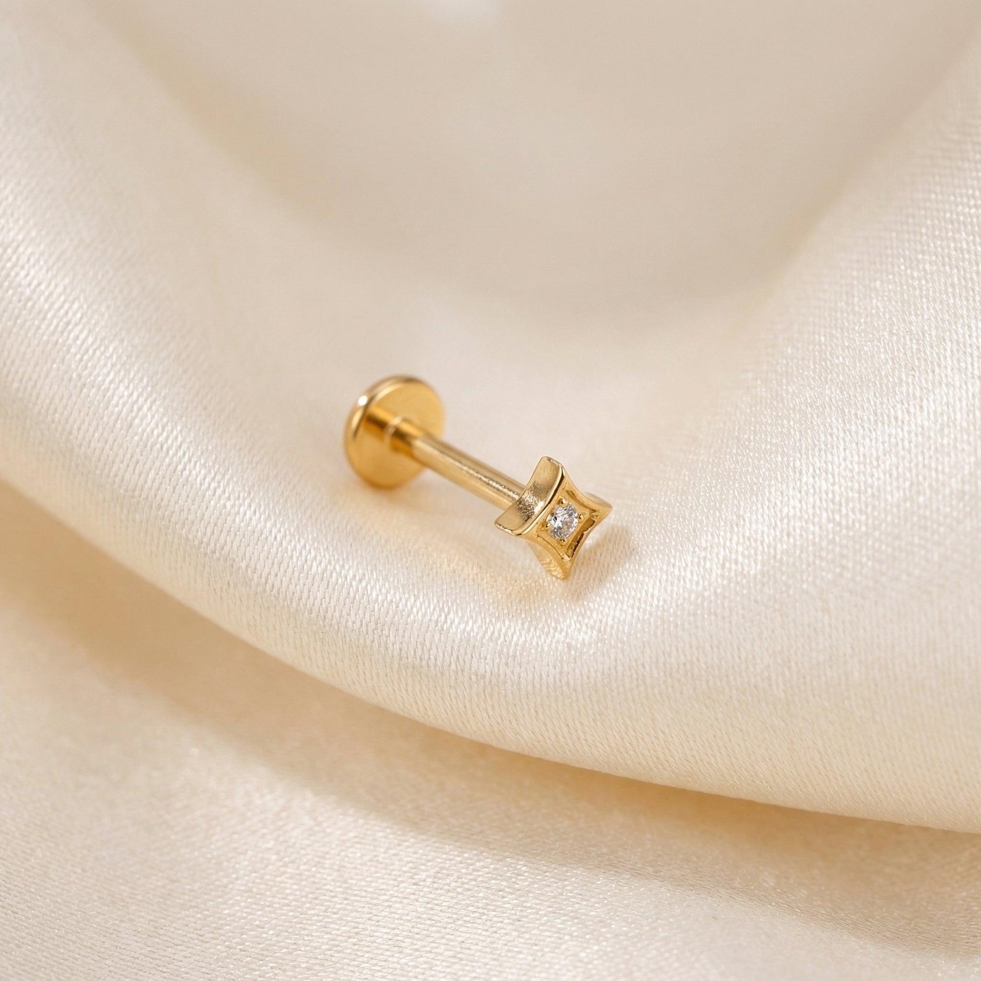 Geometric Front Helix Piercing - Gold titanium resting gracefully