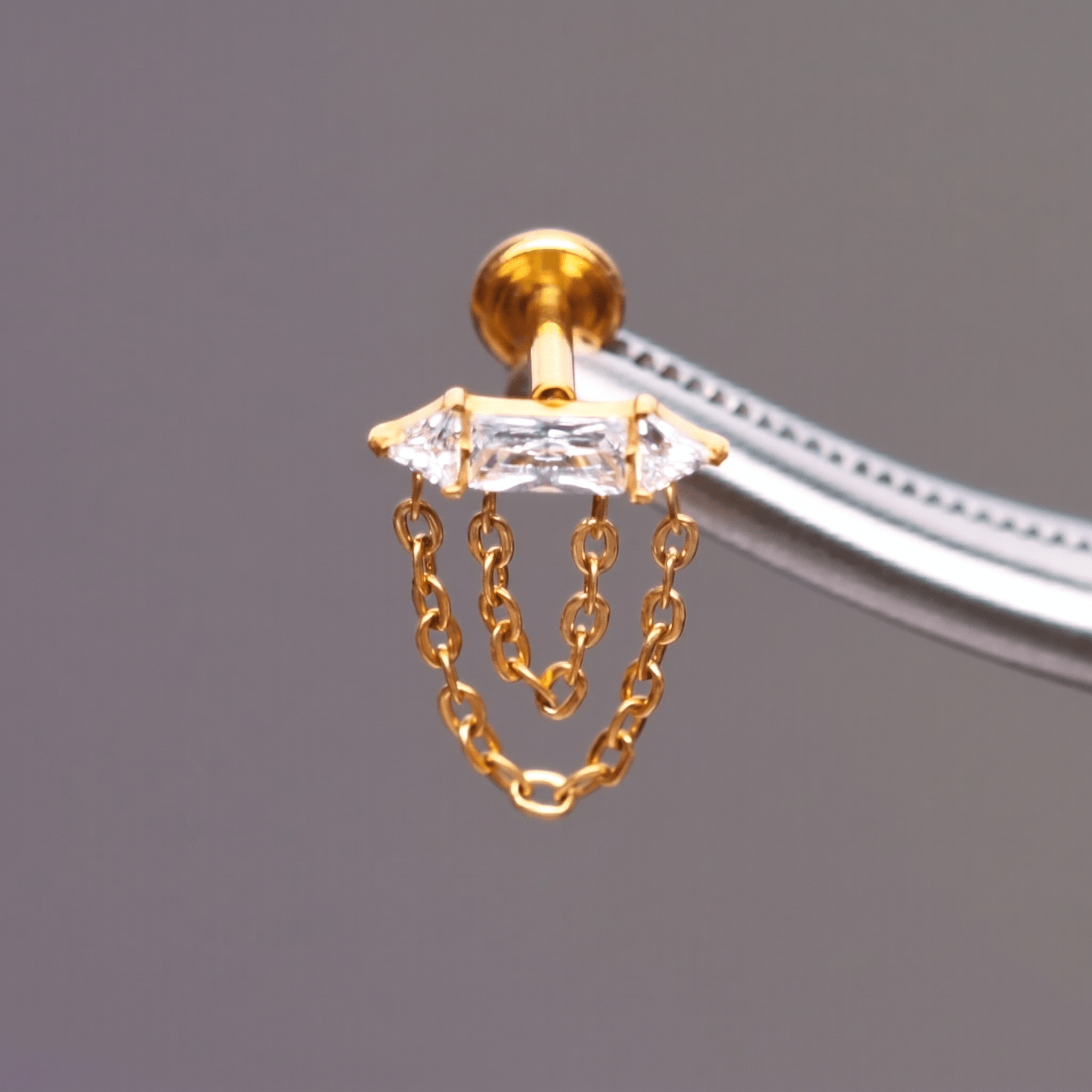 Gold Front Helix Piercing - Detailed view of cz