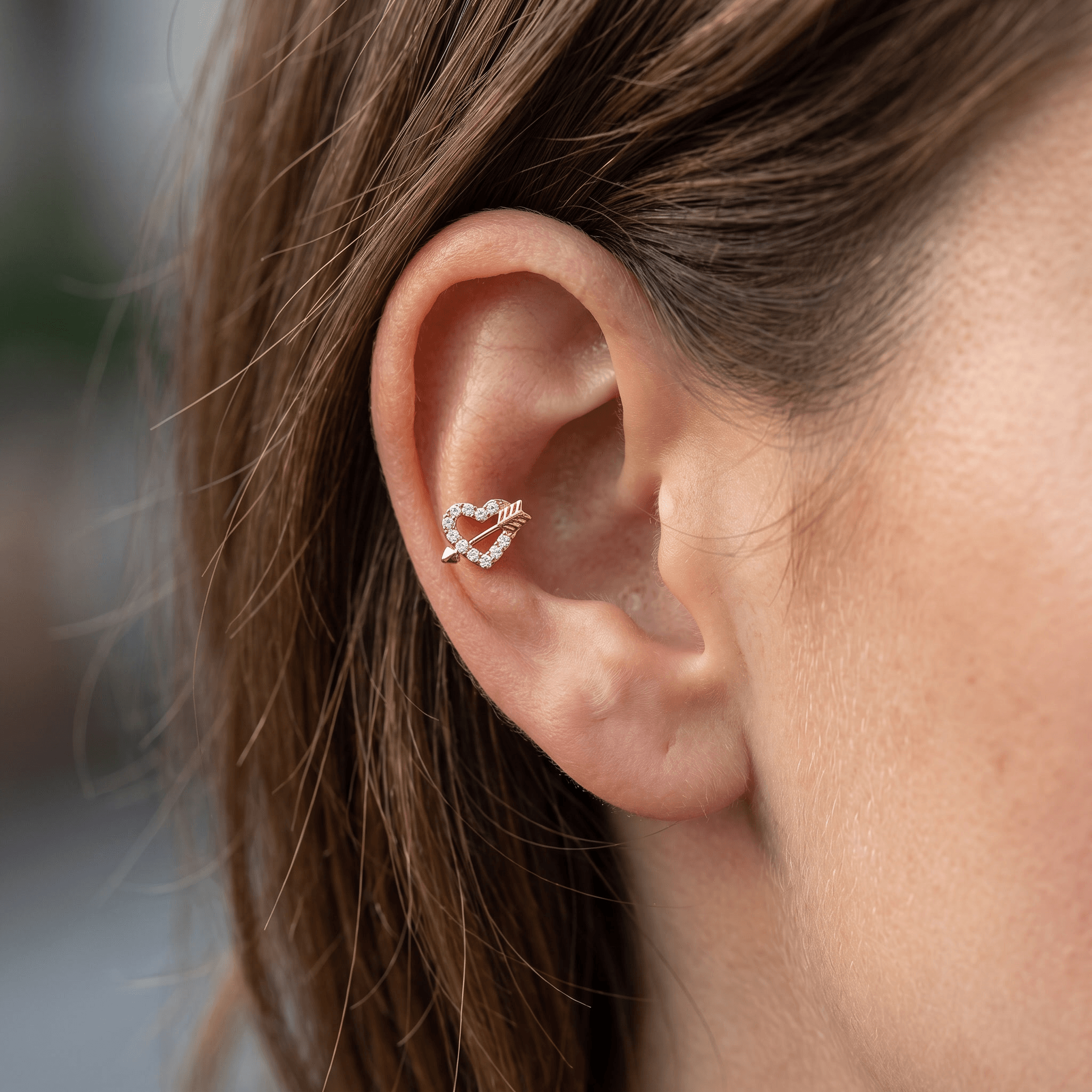 Silver heart arrow zircon stud — mid helix piercing placement