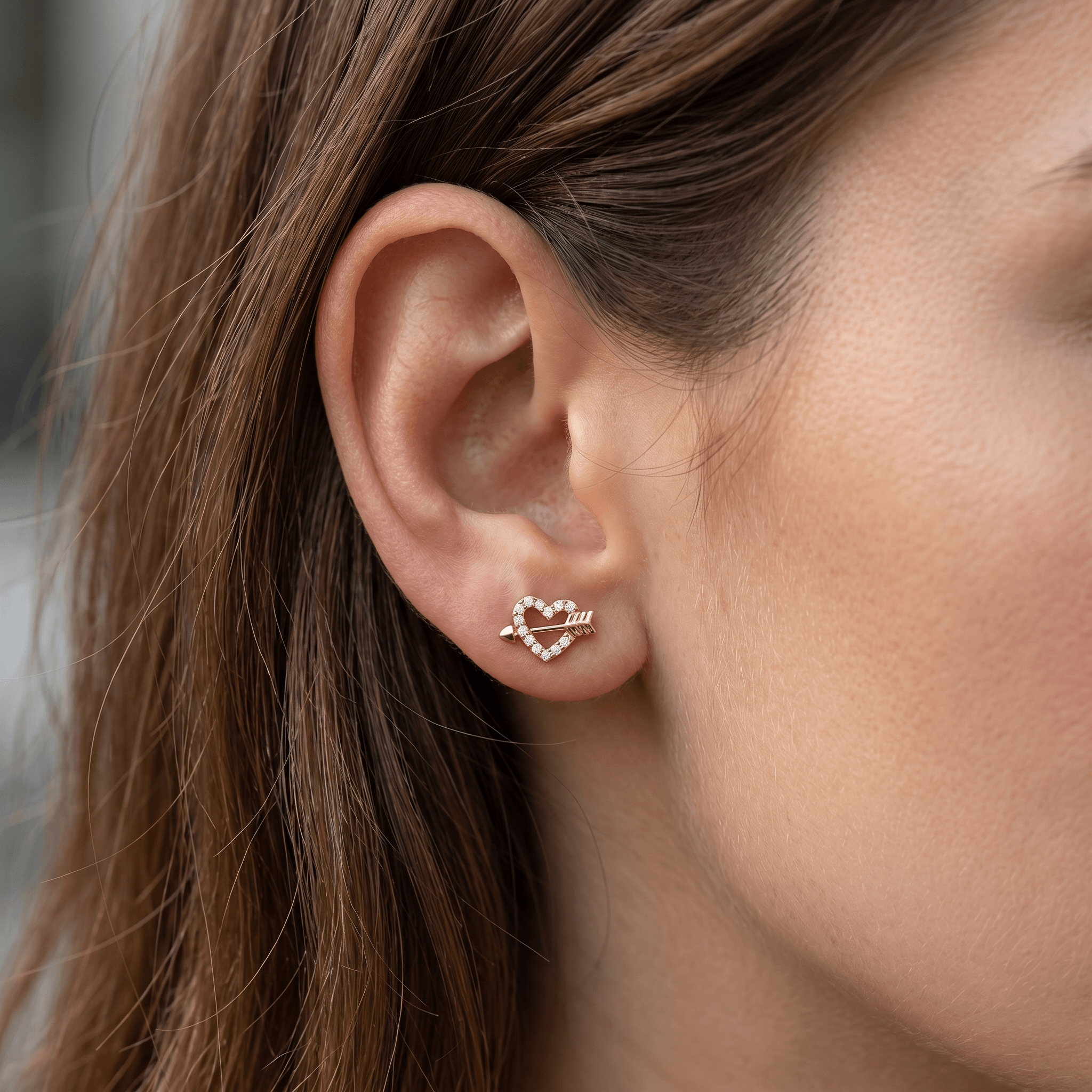 Gold heart arrow zircon stud — anti tragus placement