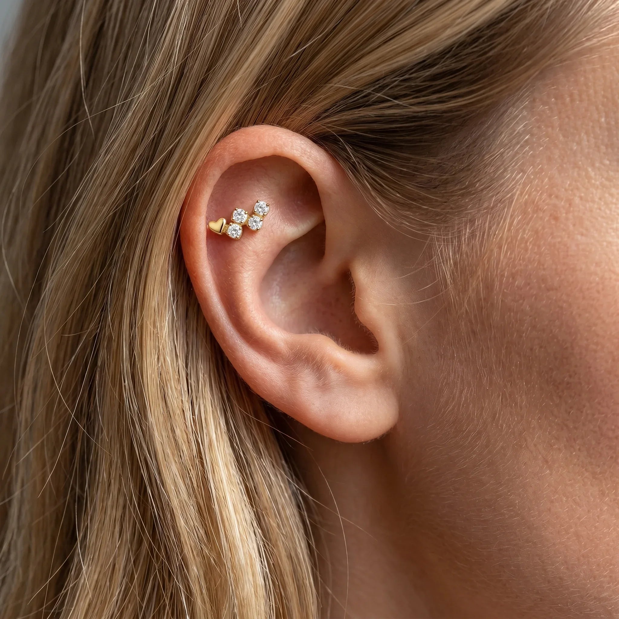 Gold heart cz cluster jewelry with clear stones styled in a curated
