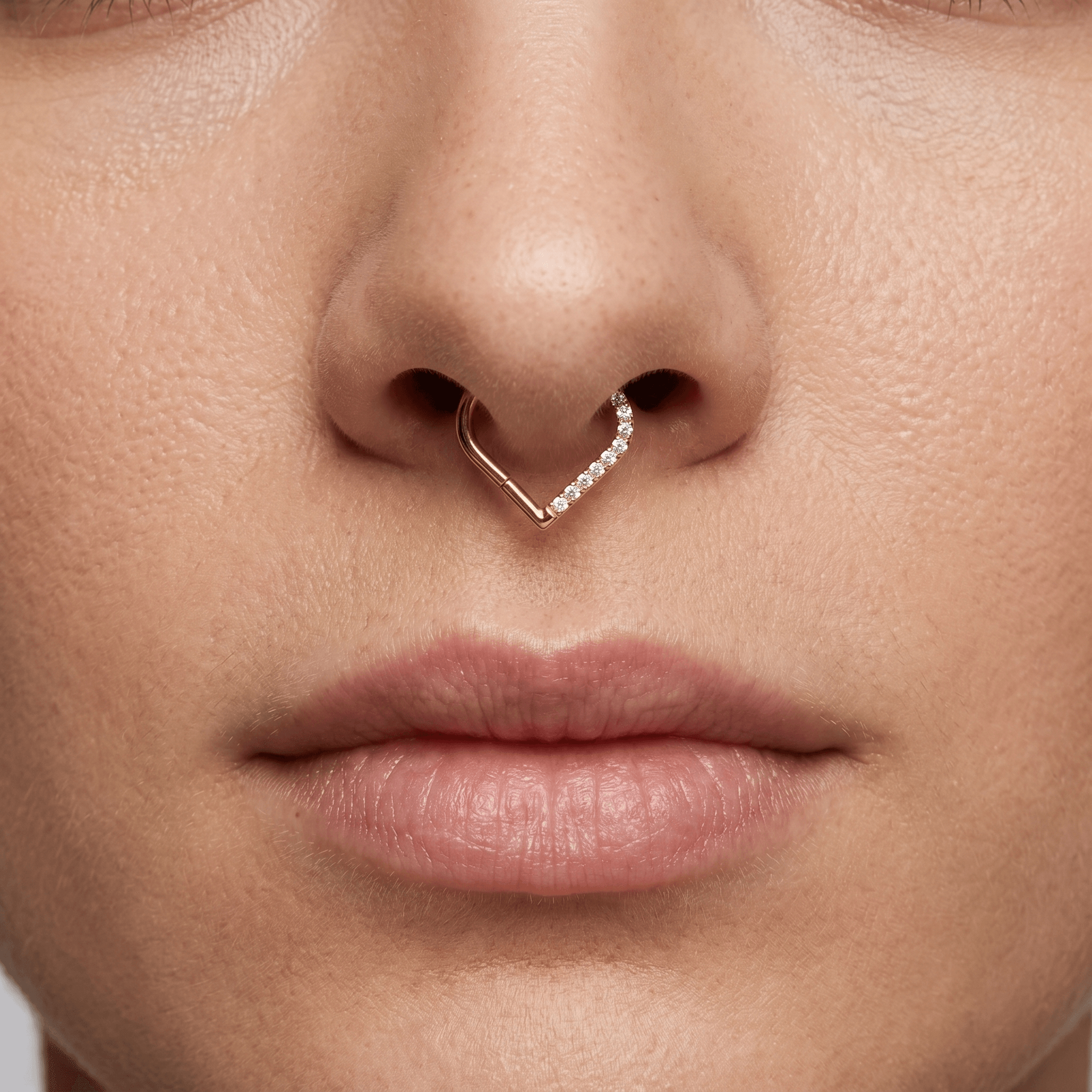 Front view close-up of a model wearing the gold heart shaped zircon