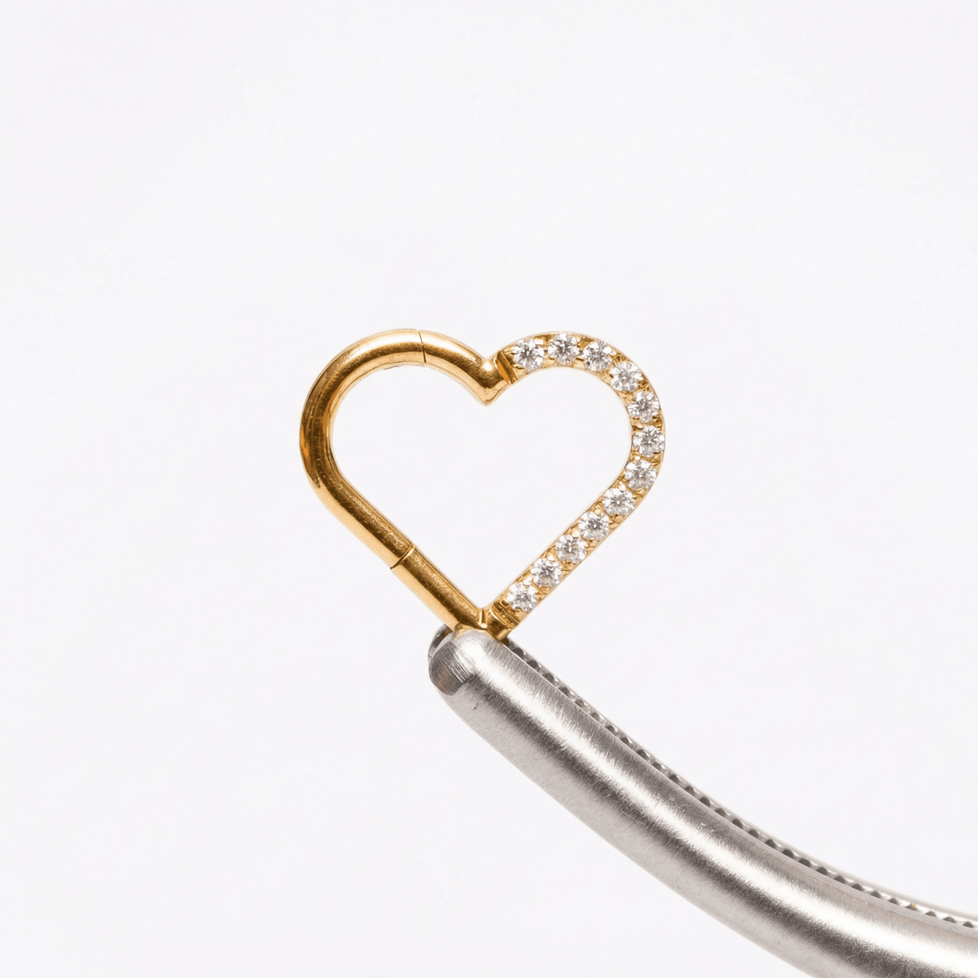 Heart Piercing In Septum - Gold heart shaped piercing