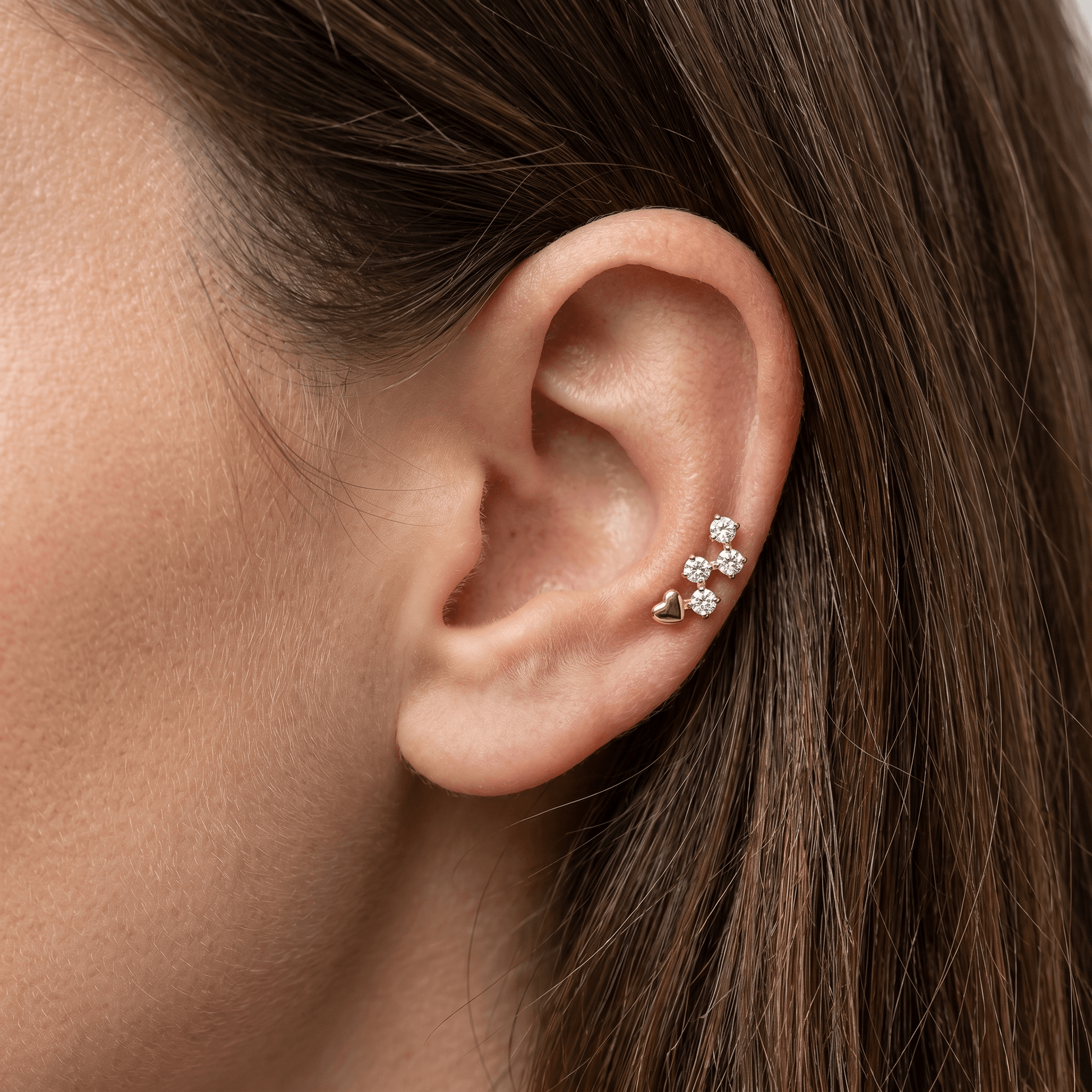 Gold heart cluster faux stud worn in a .