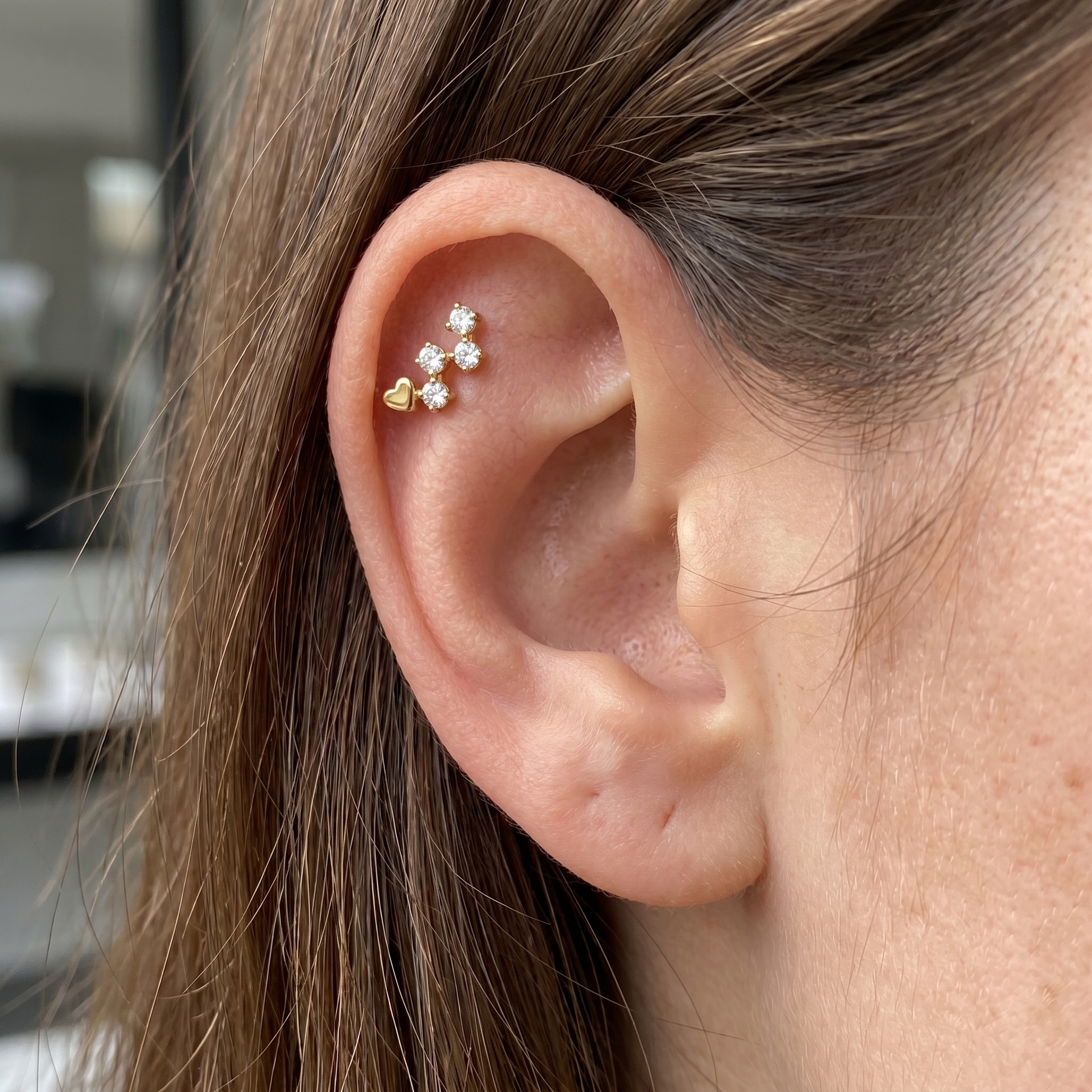 Gold heart & zircon stud — flat helix piercing placement