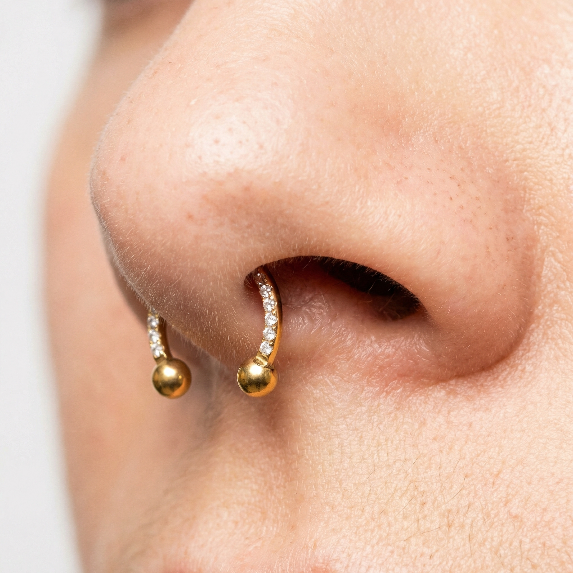 Gold zircon pave hinged stud — small septum placement