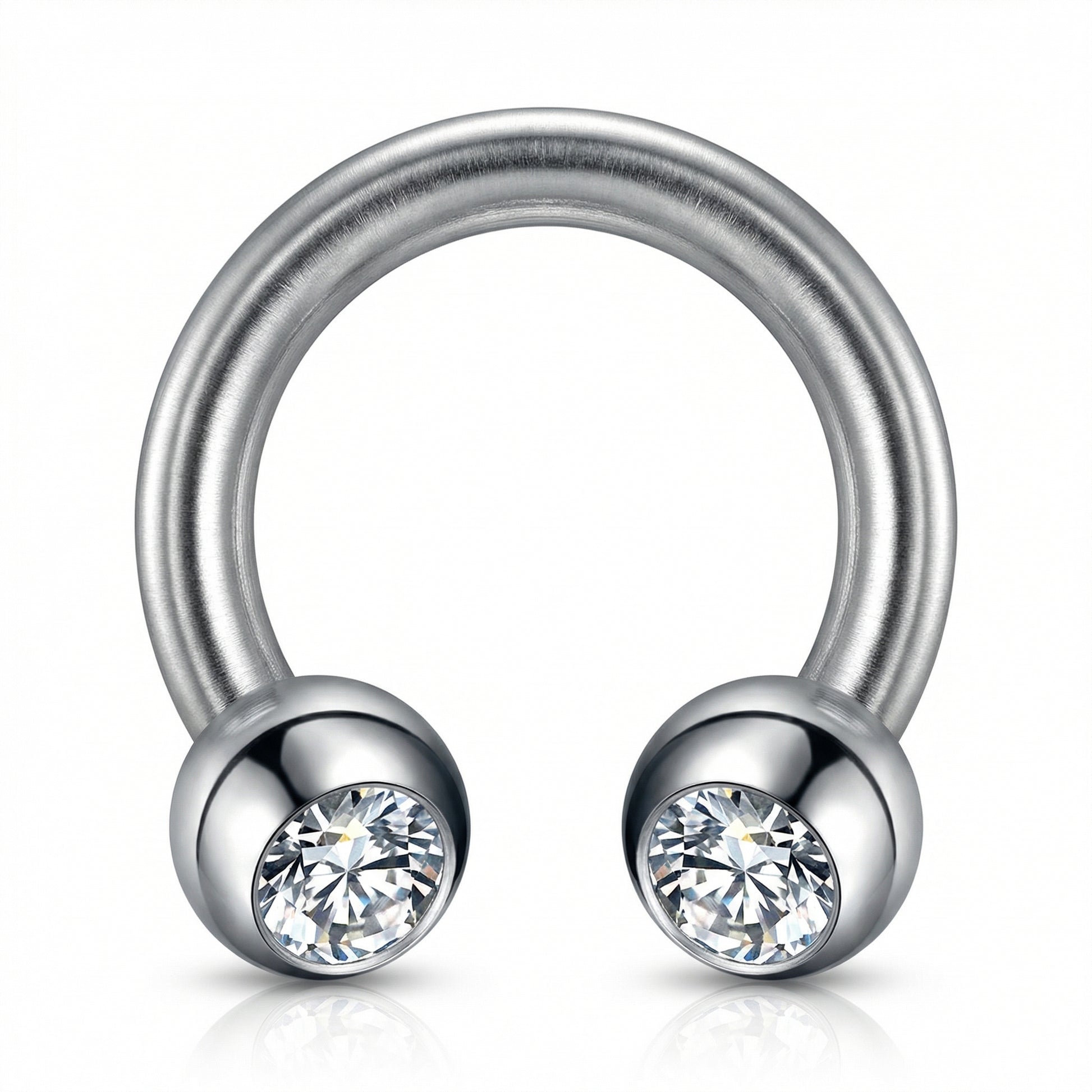Macro view of a silver titanium crystal ball horseshoe ring highlighting the
