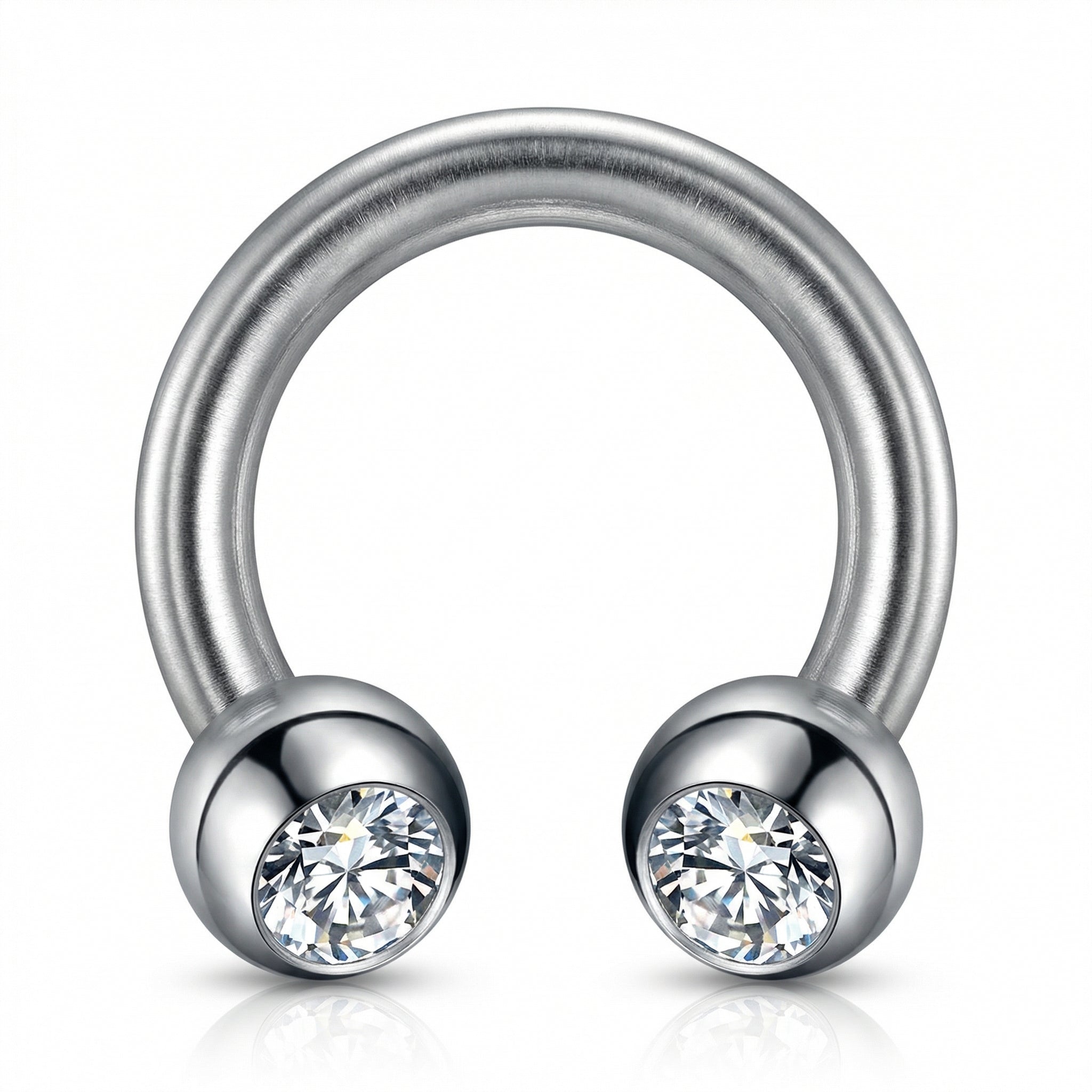Macro view of a silver titanium crystal ball horseshoe ring highlighting the