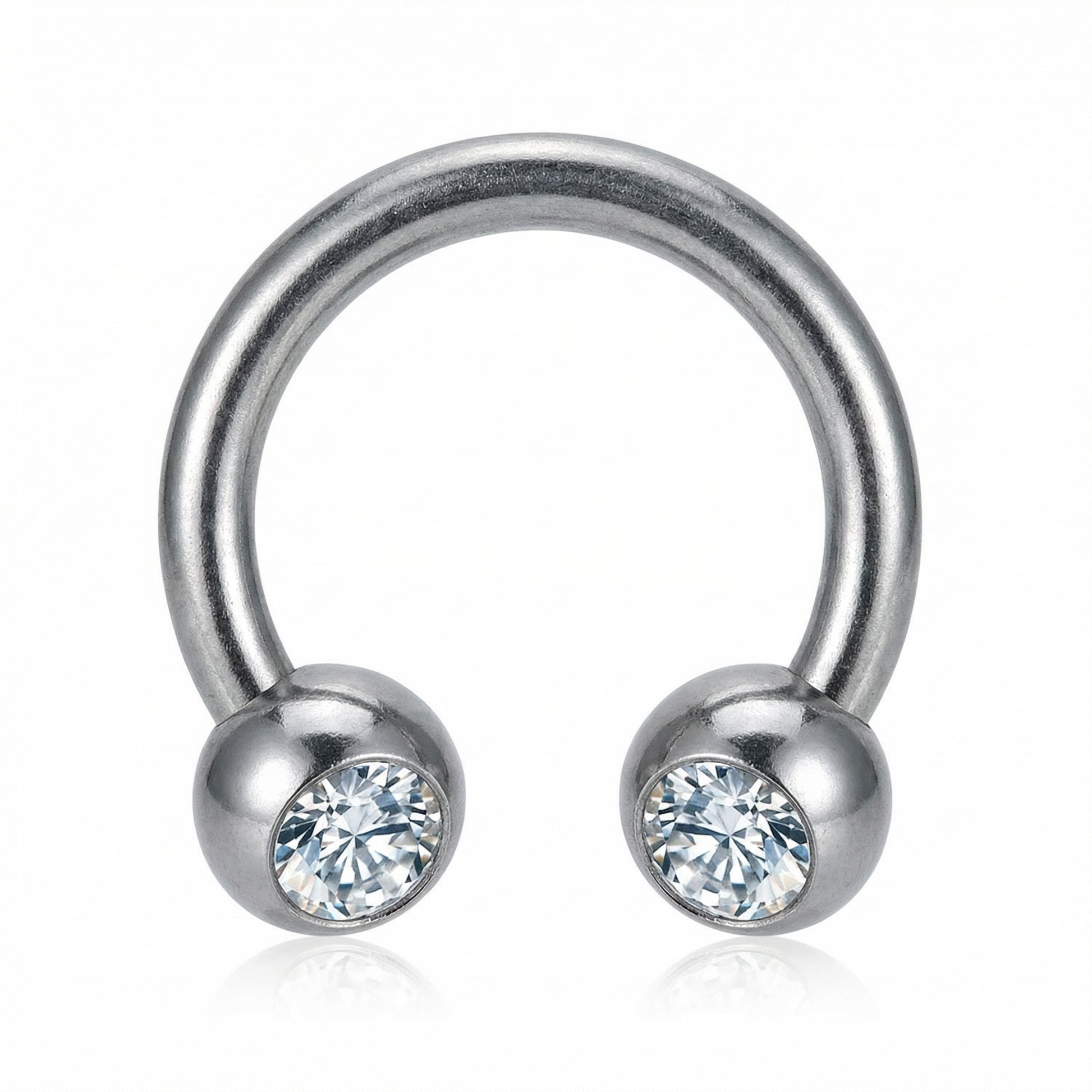 Front-facing close-up of a silver titanium crystal ball horseshoe ring.