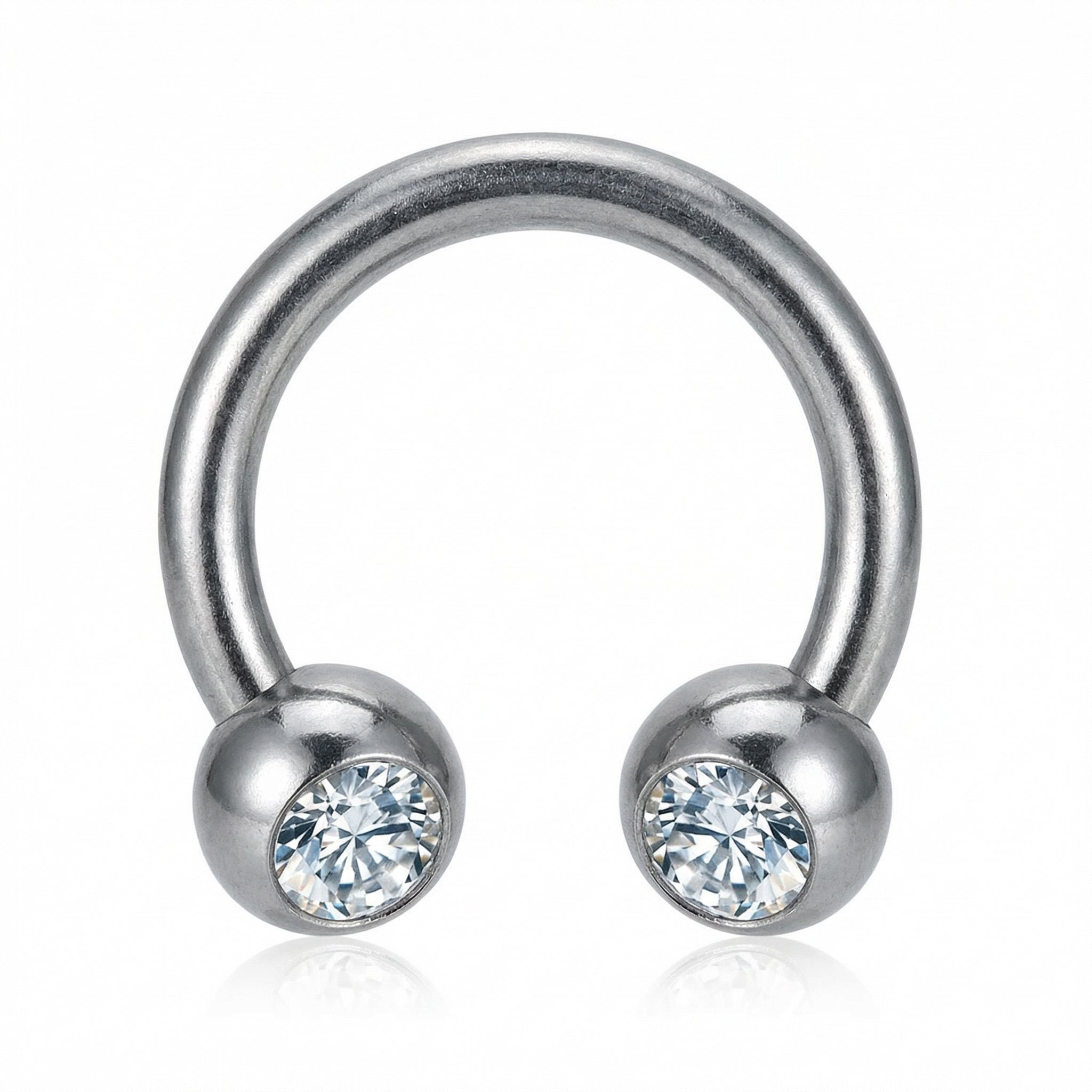 Front-facing close-up of a silver titanium crystal ball horseshoe ring.