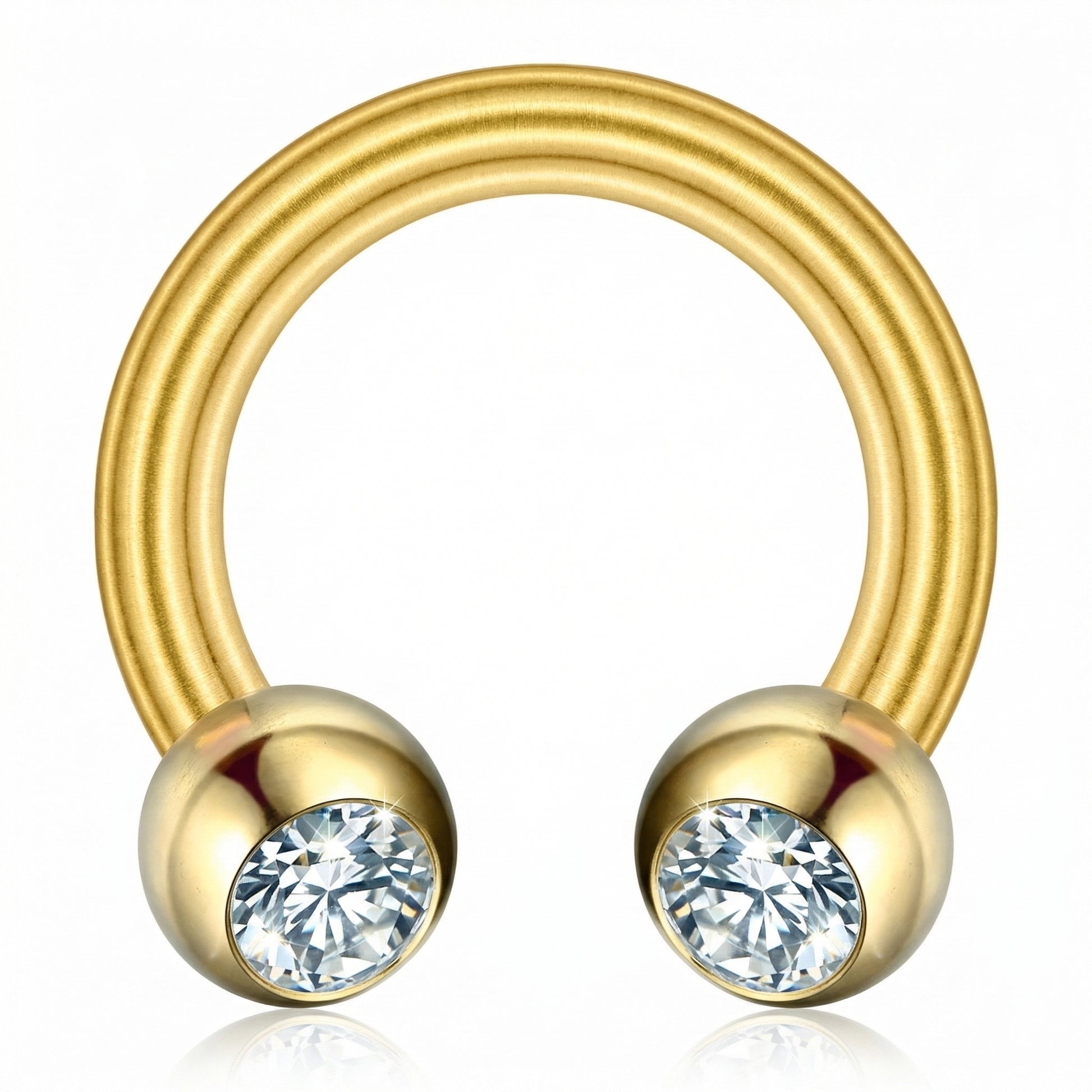 Macro view of a gold titanium crystal ball horseshoe ring highlighting the