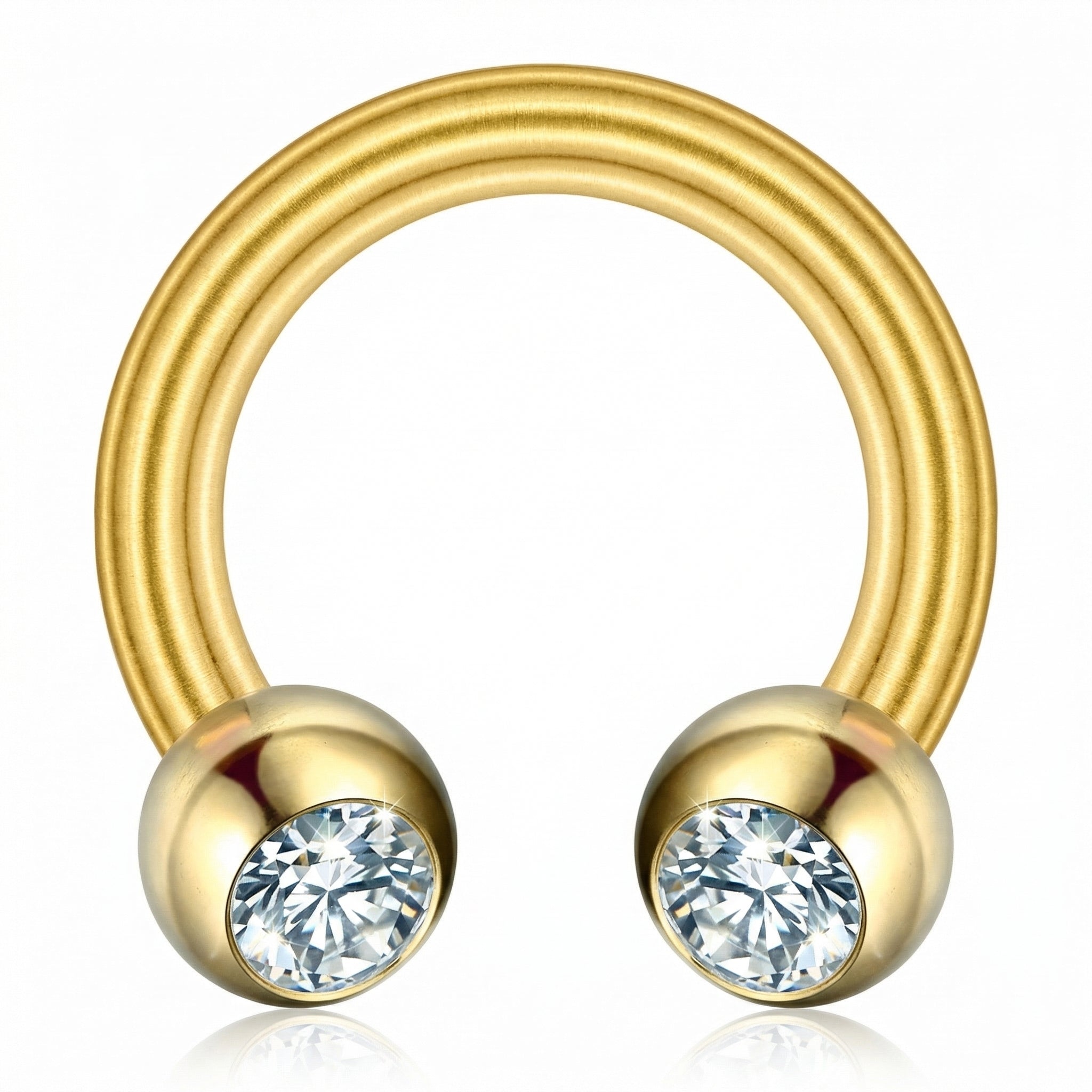Macro view of a gold titanium crystal ball horseshoe ring highlighting the