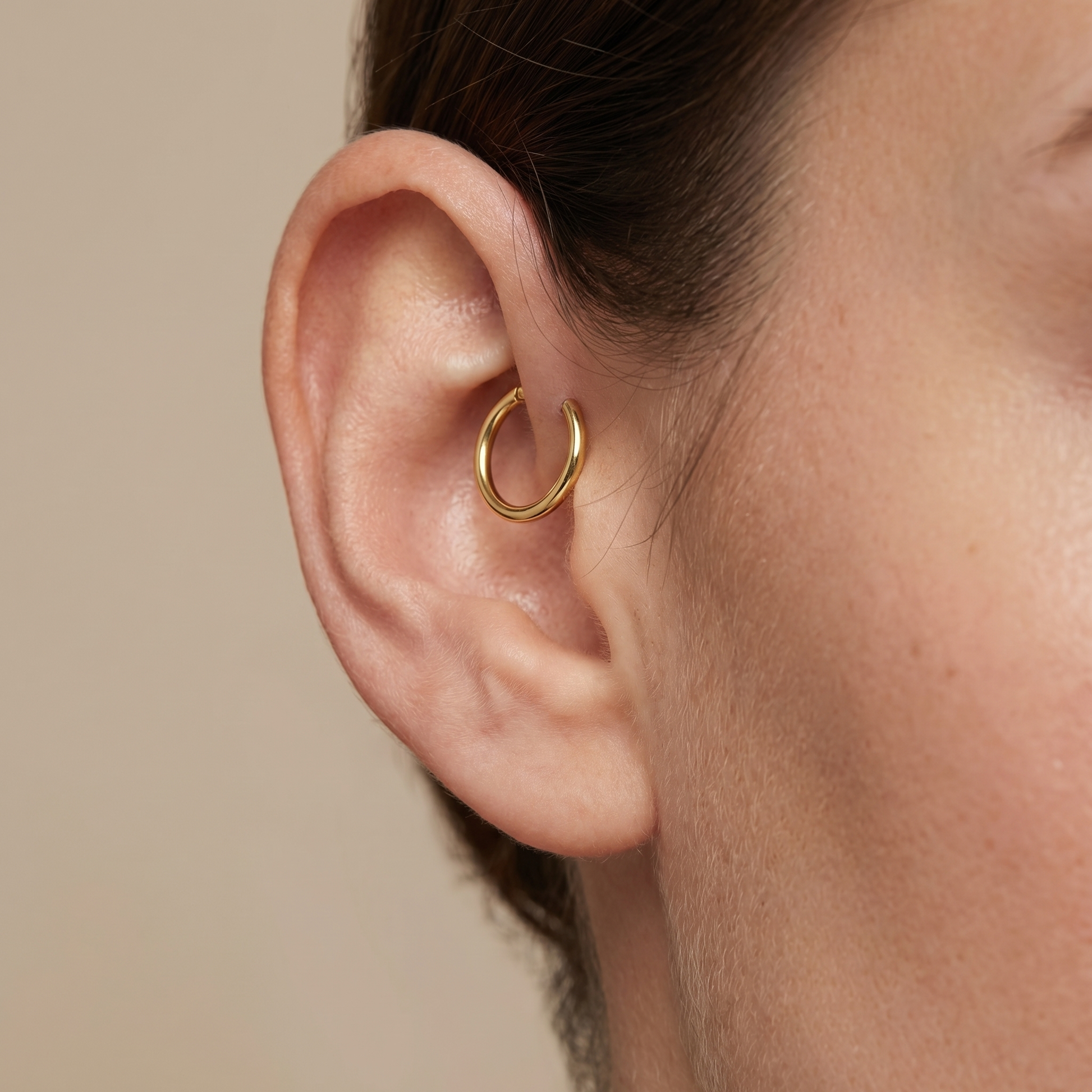 Gold minimalist plain clicker stud — forward helix piercing placement