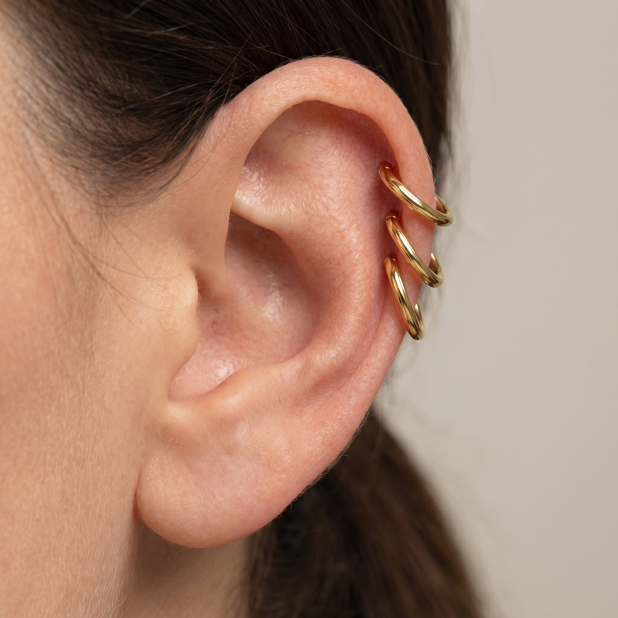 Gold minimalist plain clicker stud — triple helix piercing placement