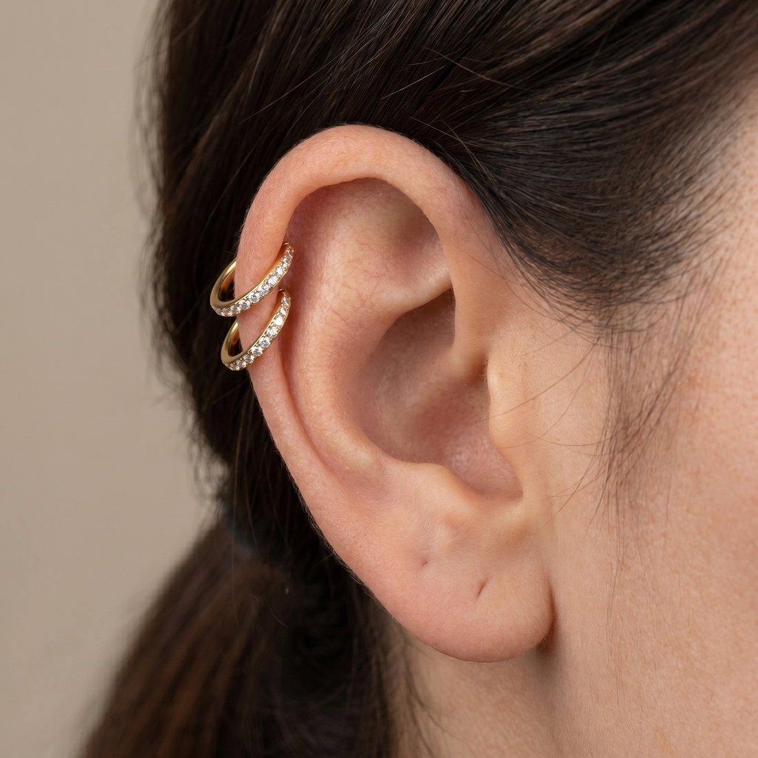 Gold zircon paved hinged stud — double helix piercing placement
