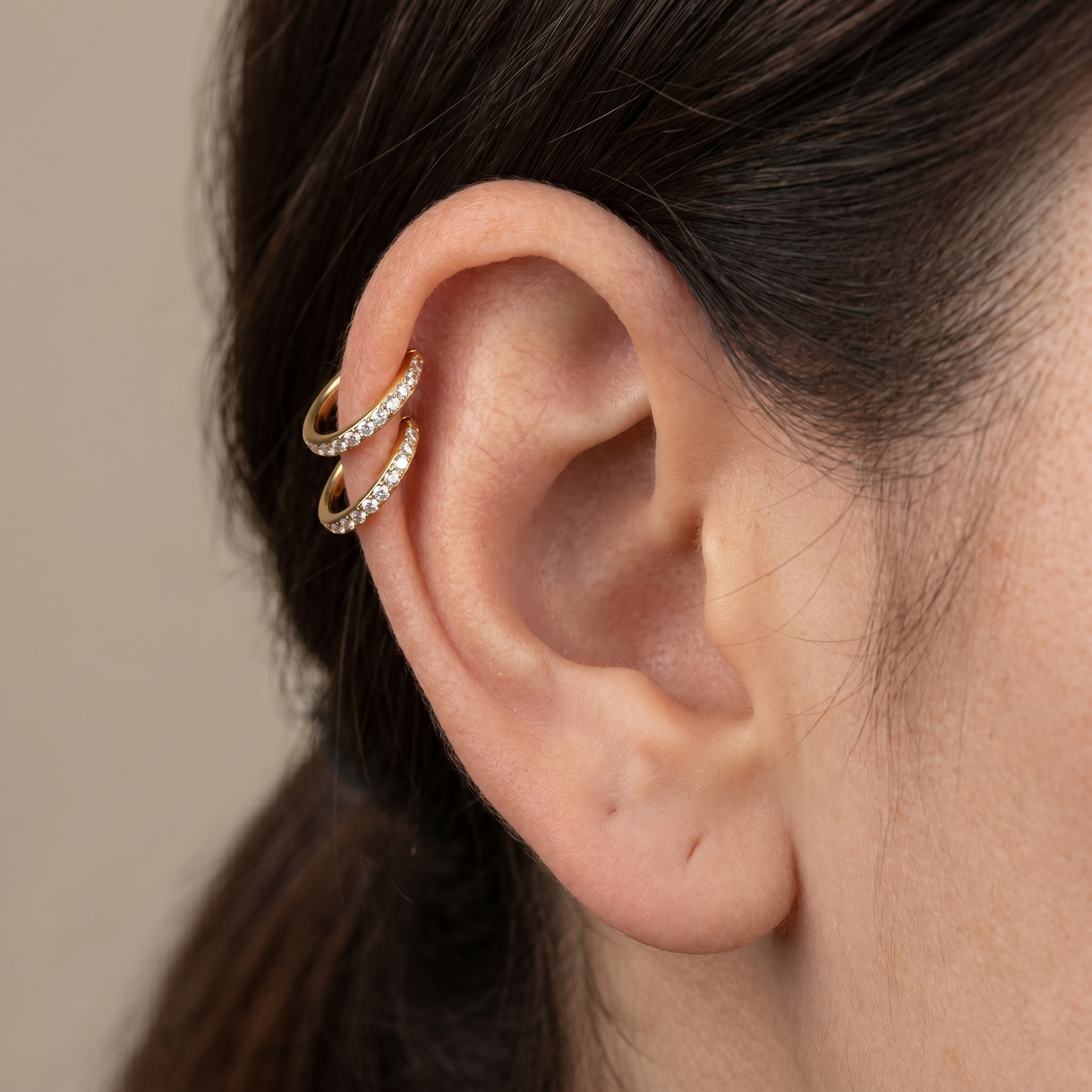 Gold zircon paved hinged stud — double helix piercing placement
