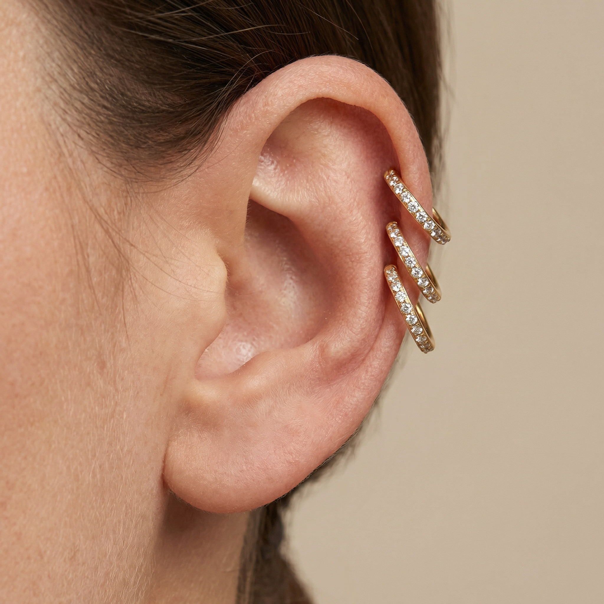 Gold zircon paved hinged stud — triple helix piercing placement