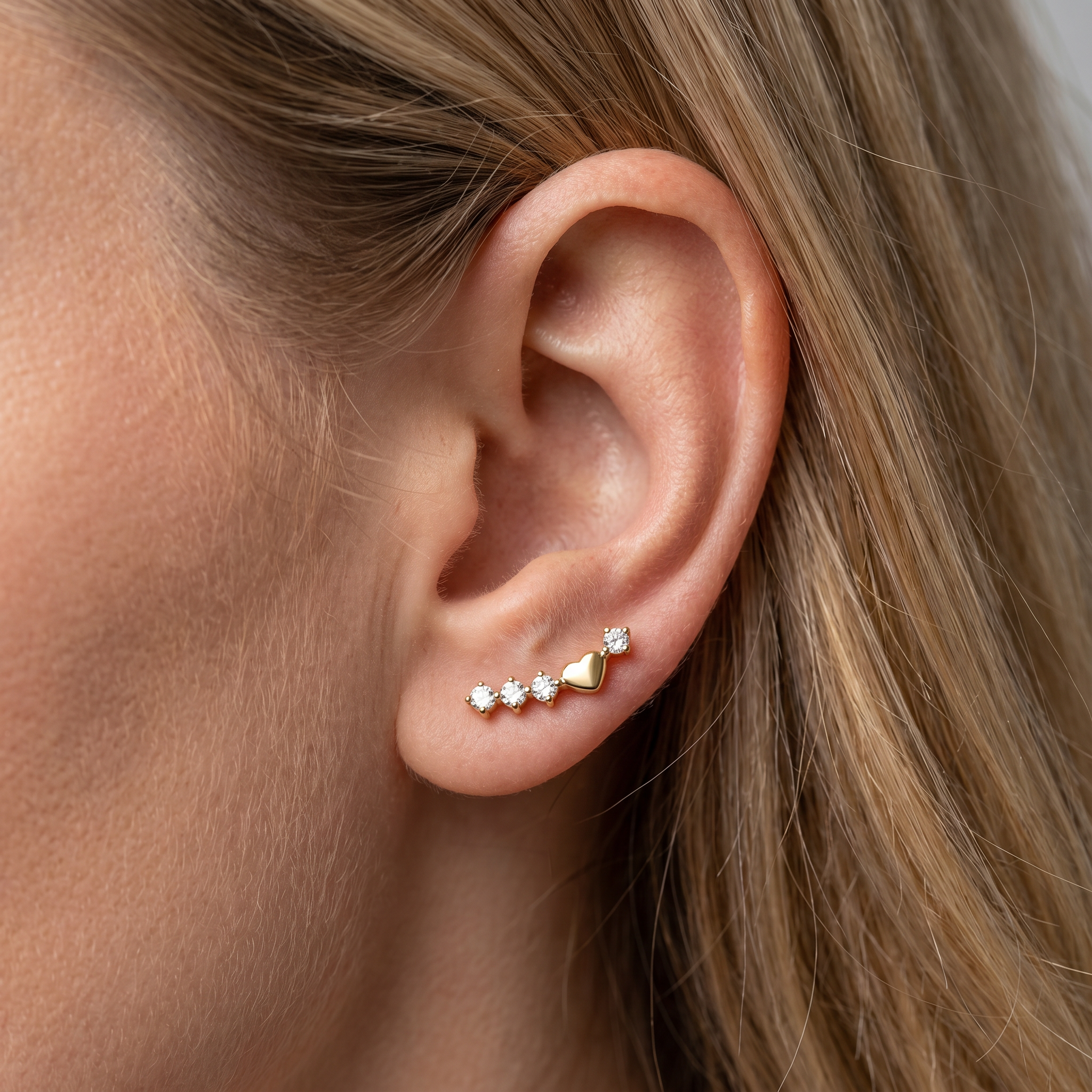 Gold curved zircon helix stud — anti tragus placement