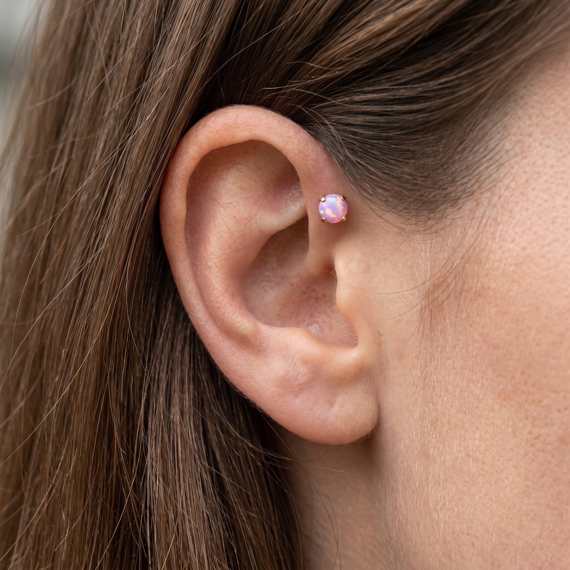 Gold 4mm opal stud — forward helix piercing placement