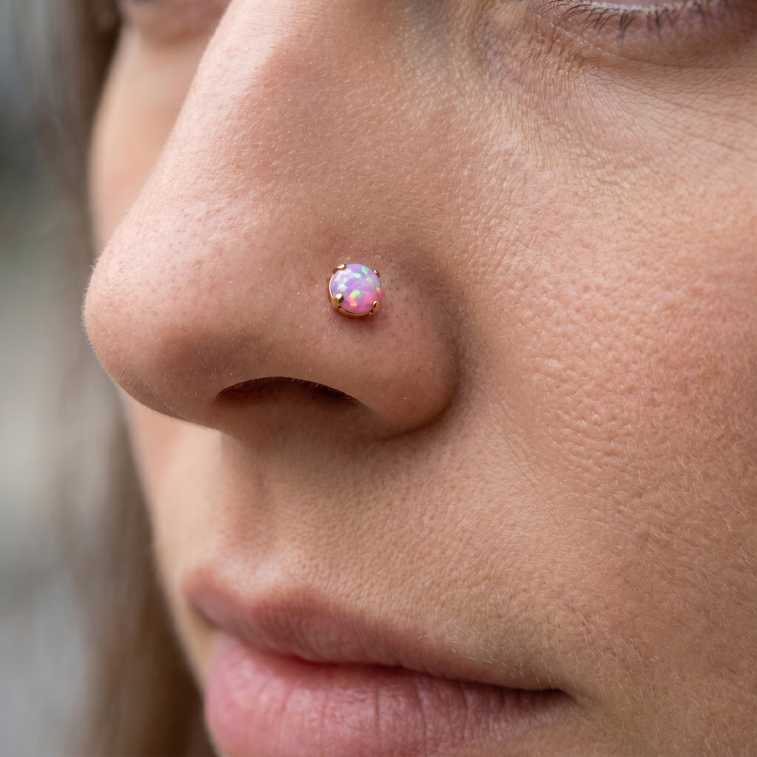 Gold opal nose stud — nose jewelry placement