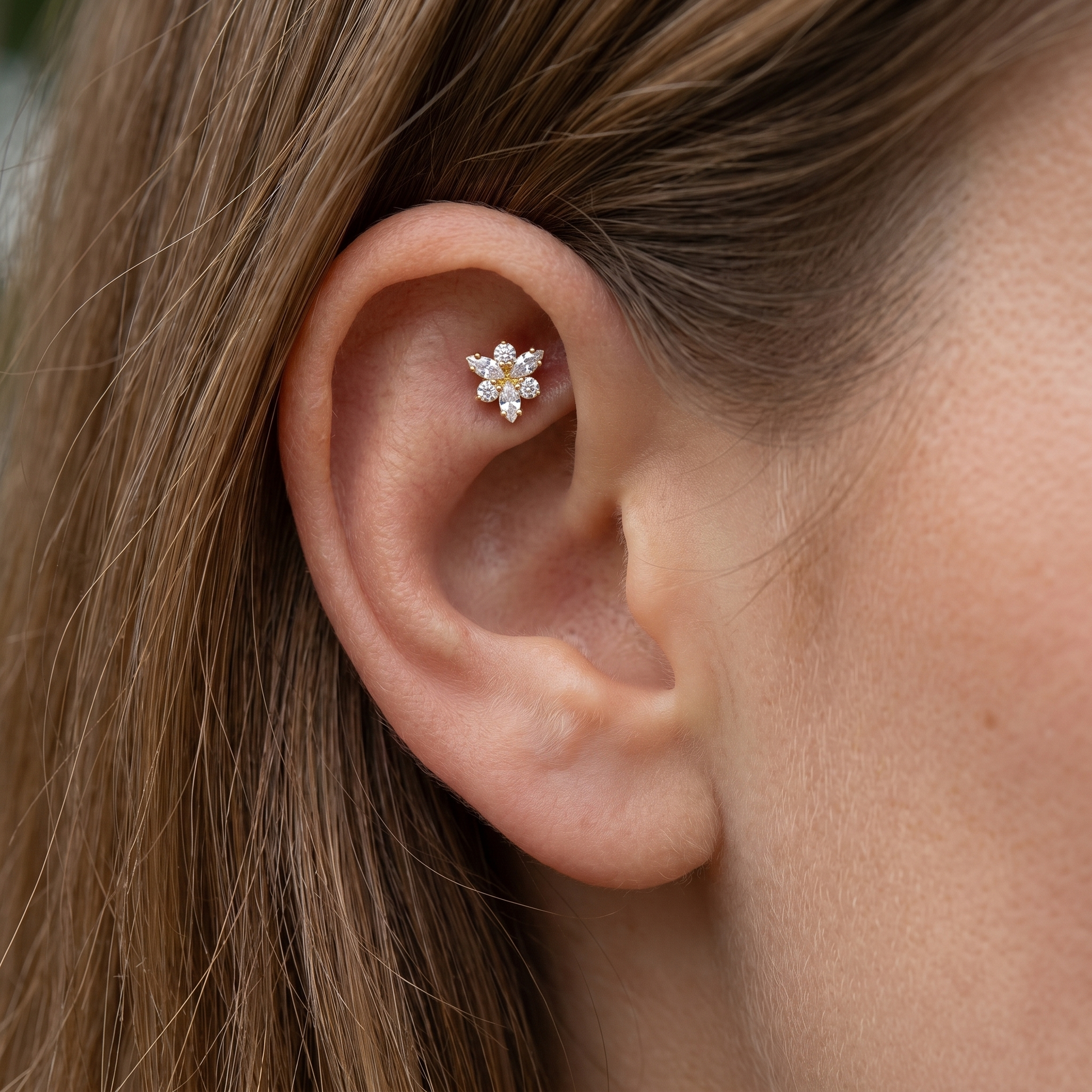 Gold snowflake zircon stud — faux rook piercing placement