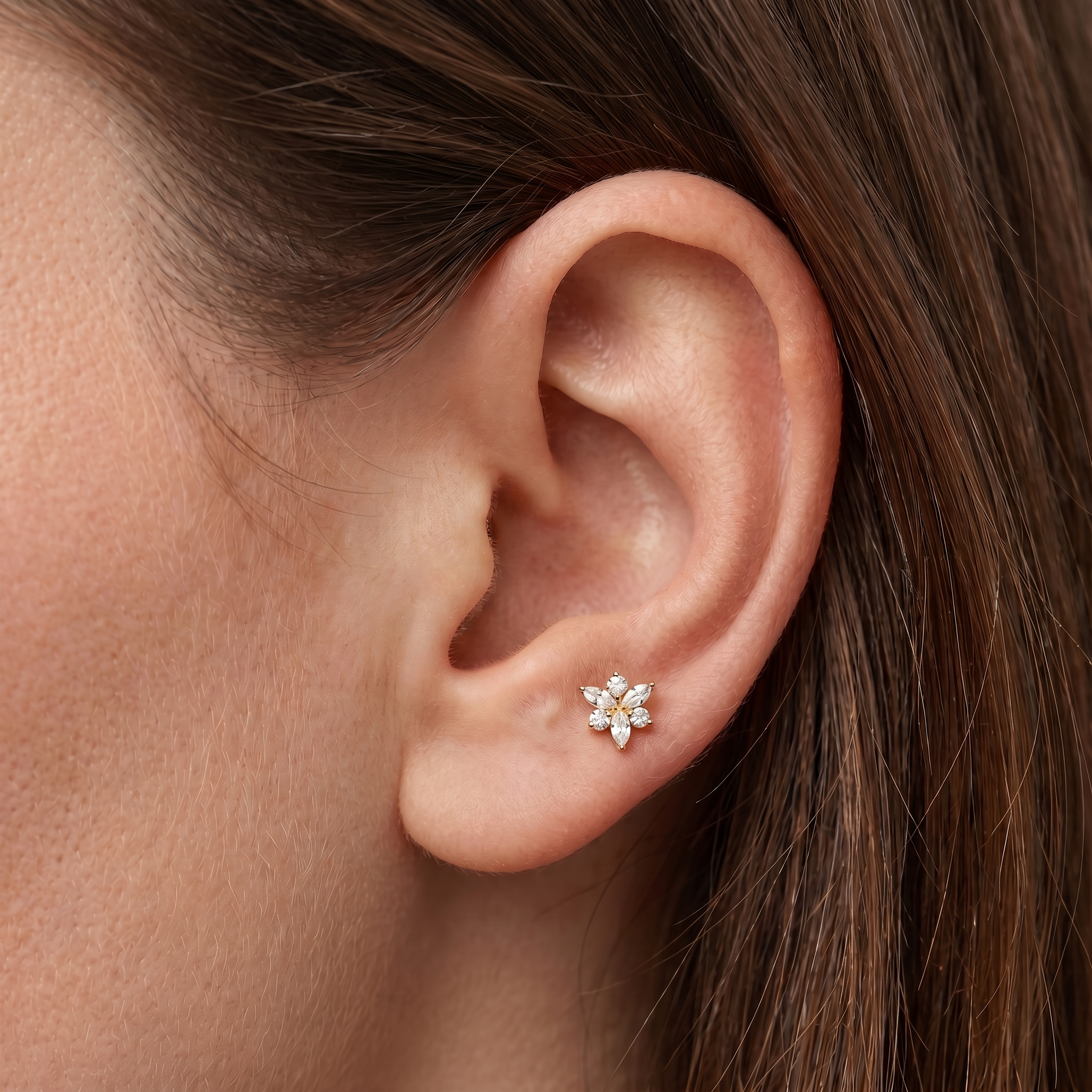 Gold snowflake zircon helix stud — anti tragus placement