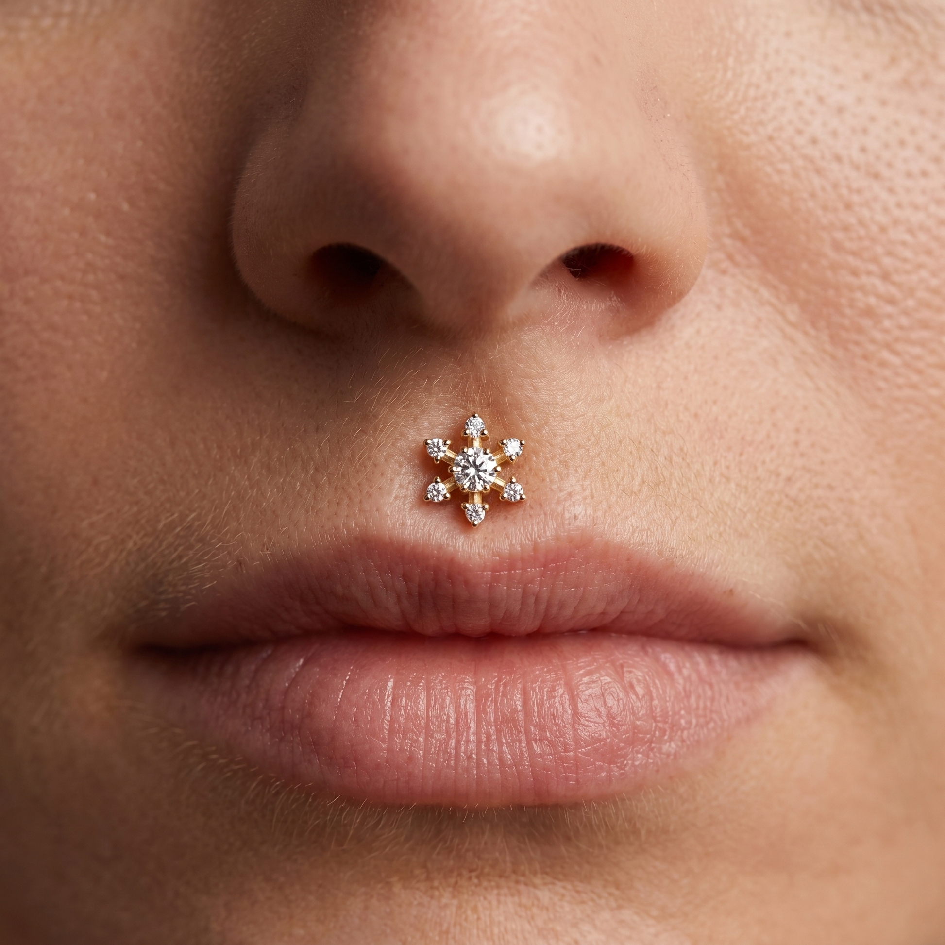 Gold flower zircon stud — medusa piercing placement
