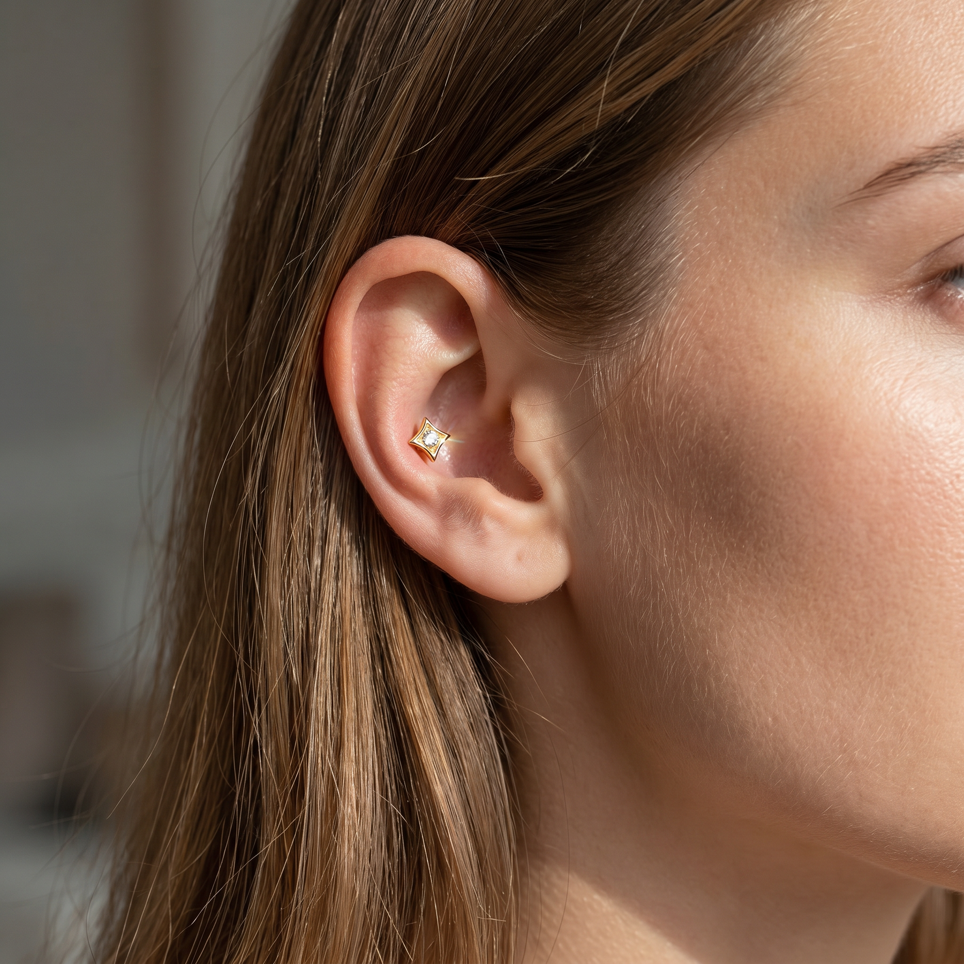 Gold geometric zircon stud — conch jewelry placement
