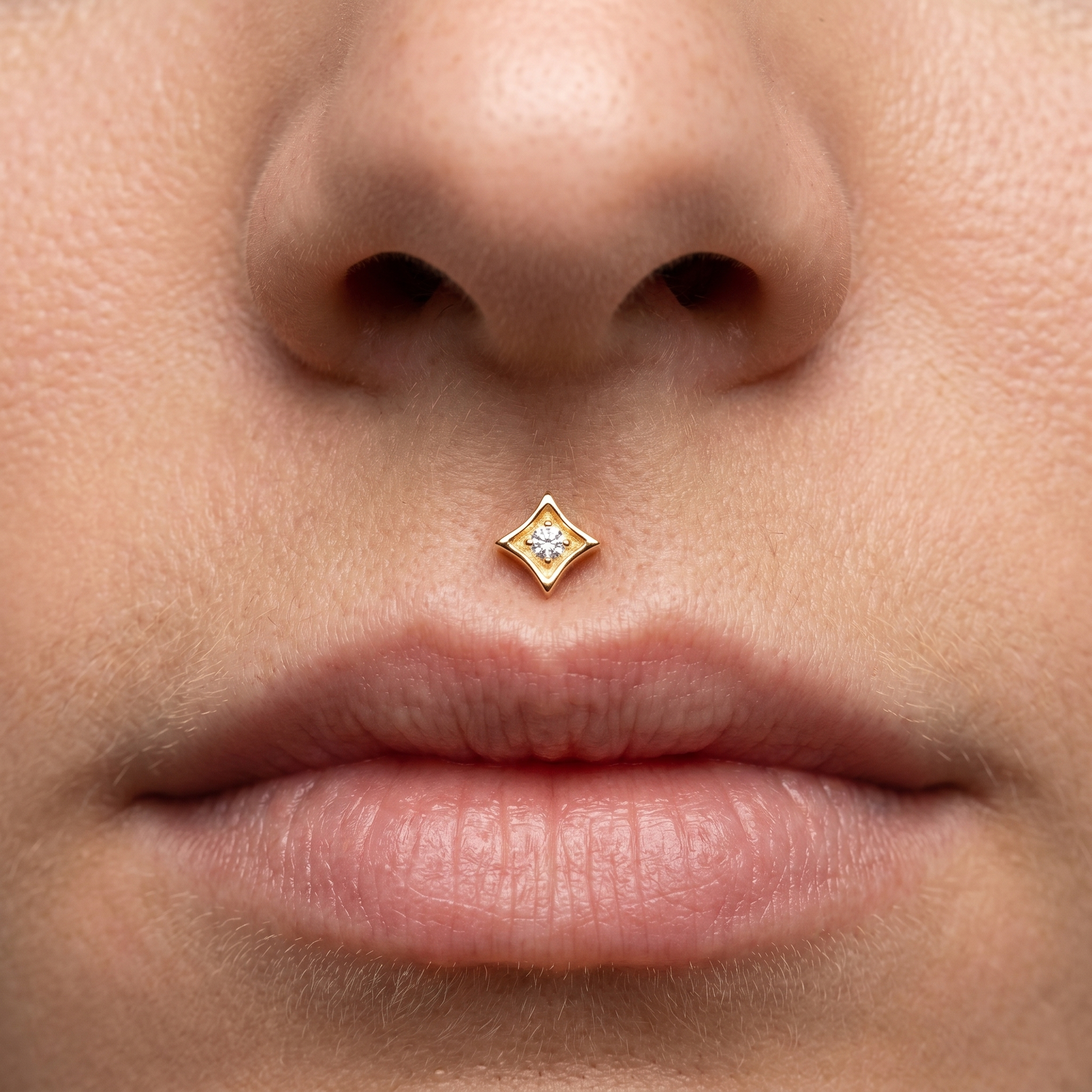 Gold geometric zircon stud — medusa piercing placement