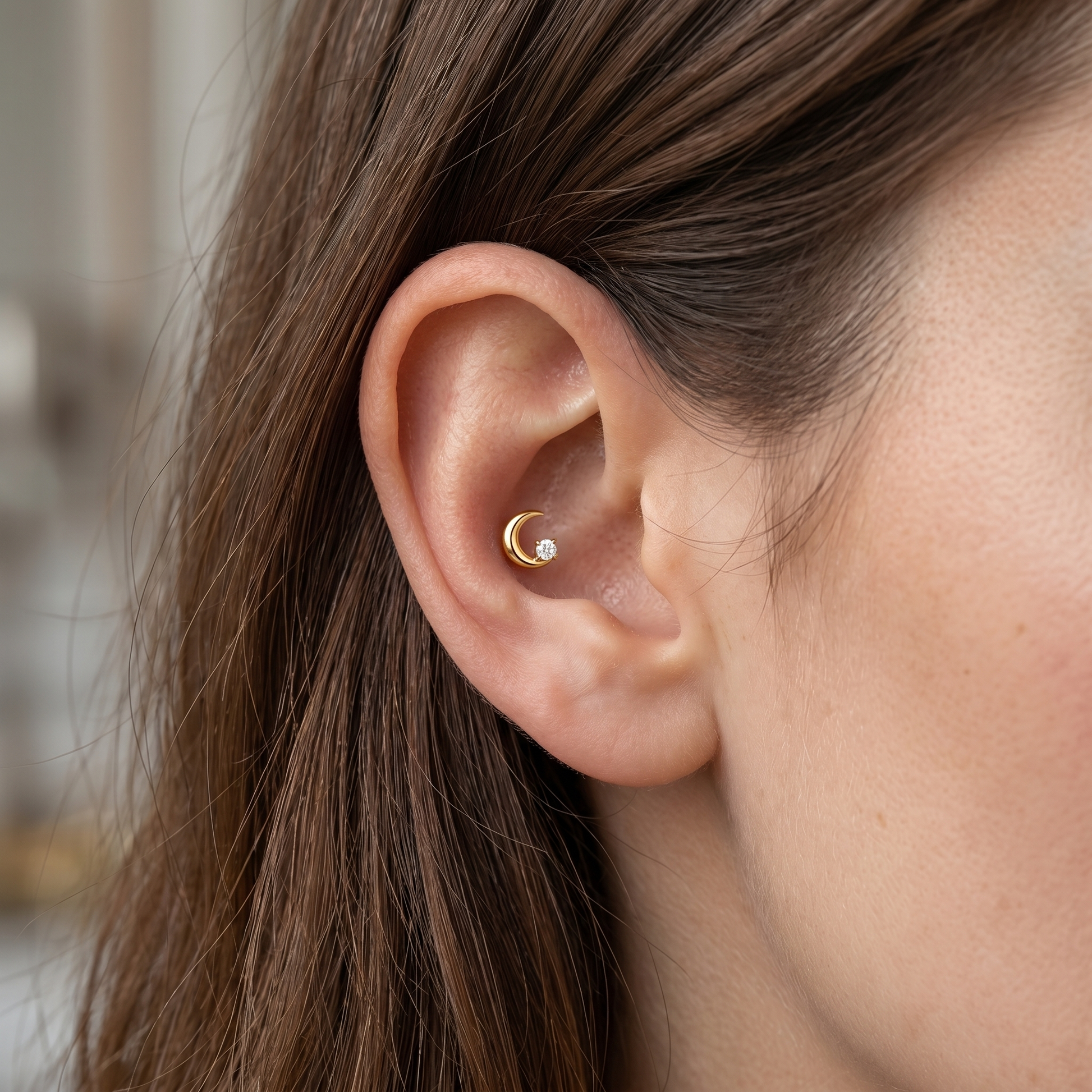 Gold crescent moon zircon stud — conch jewelry placement