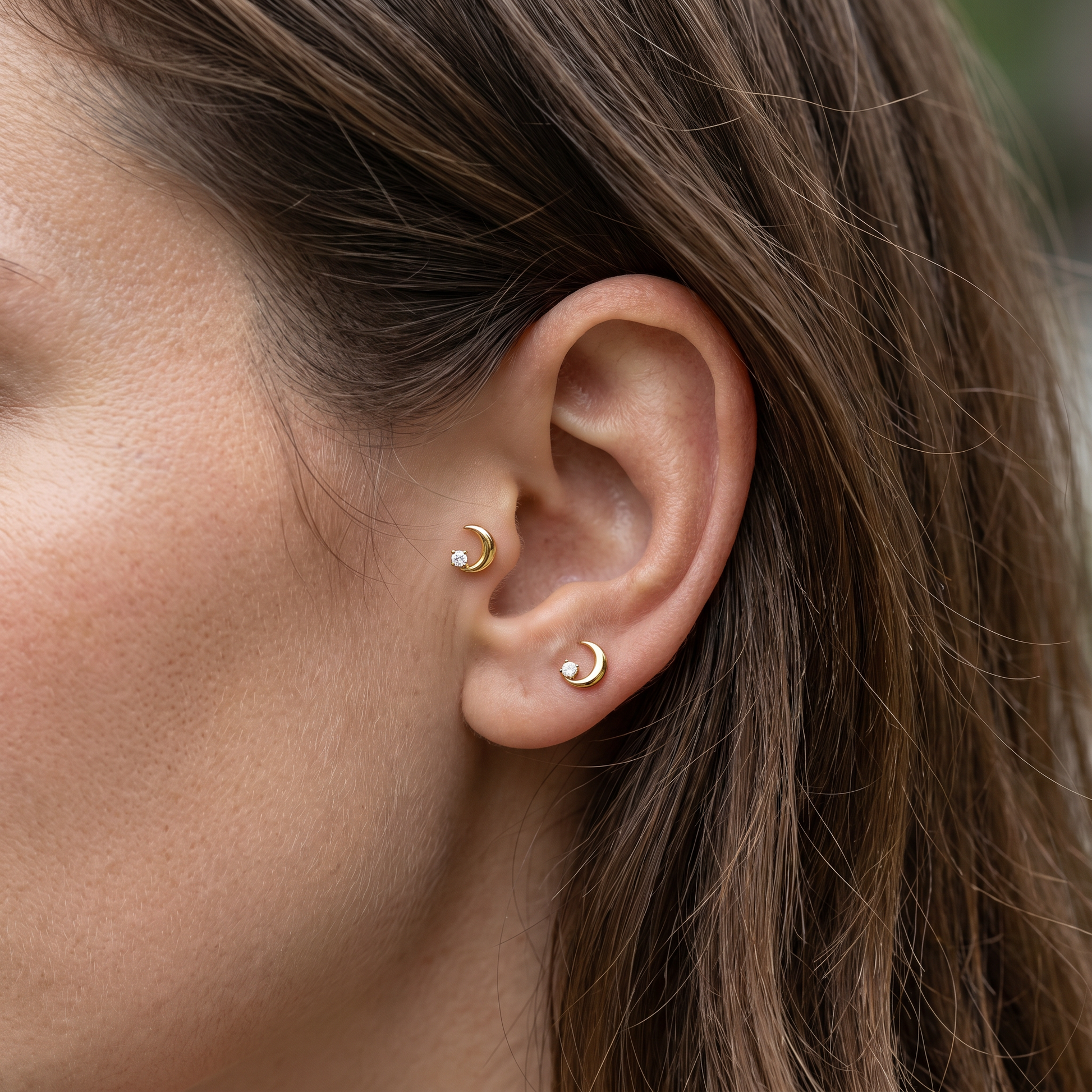 Gold crescent moon zircon stud — tragus antitragus piercing placement
