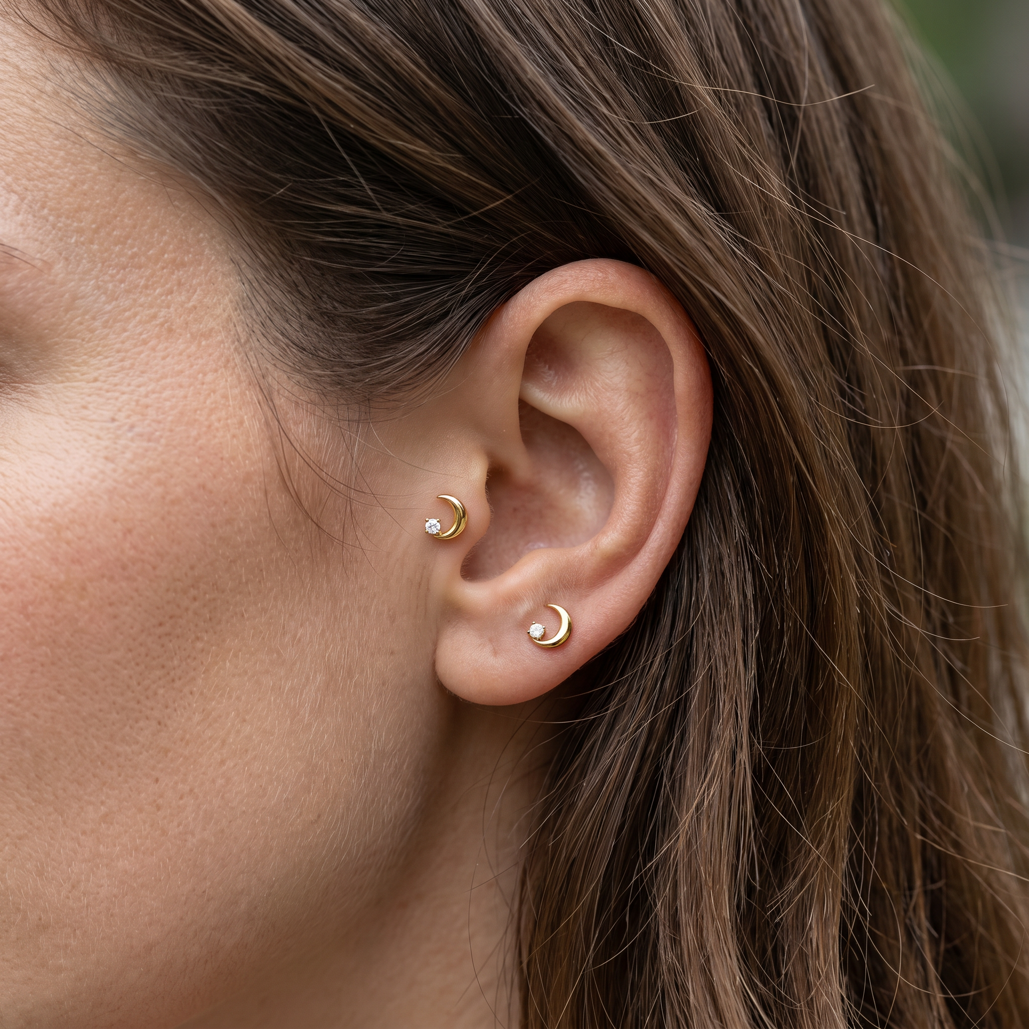Gold crescent moon zircon stud — tragus antitragus piercing placement