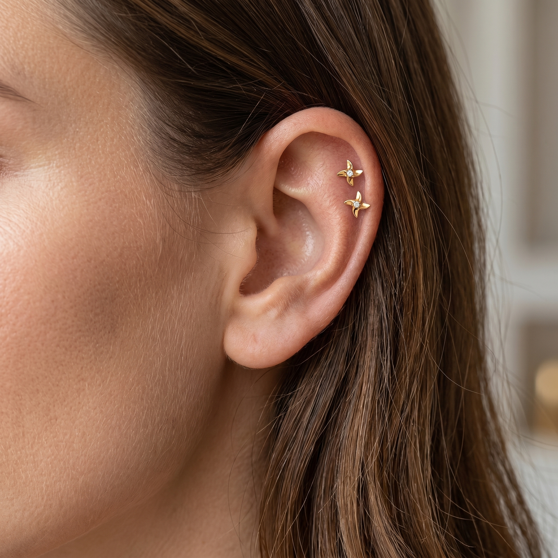 Gold pinwheel zircon stud — double helix piercing placement