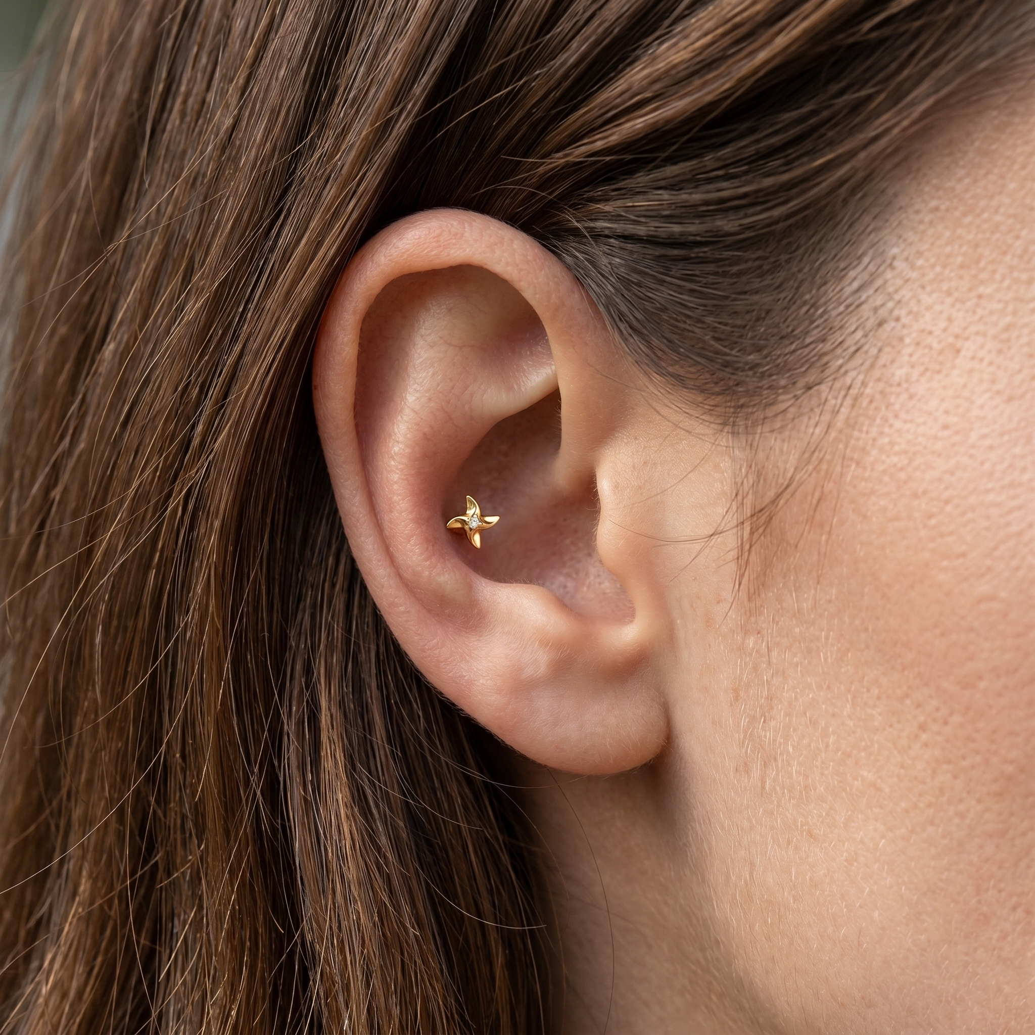 Silver pinwheel zircon stud — conch jewelry placement