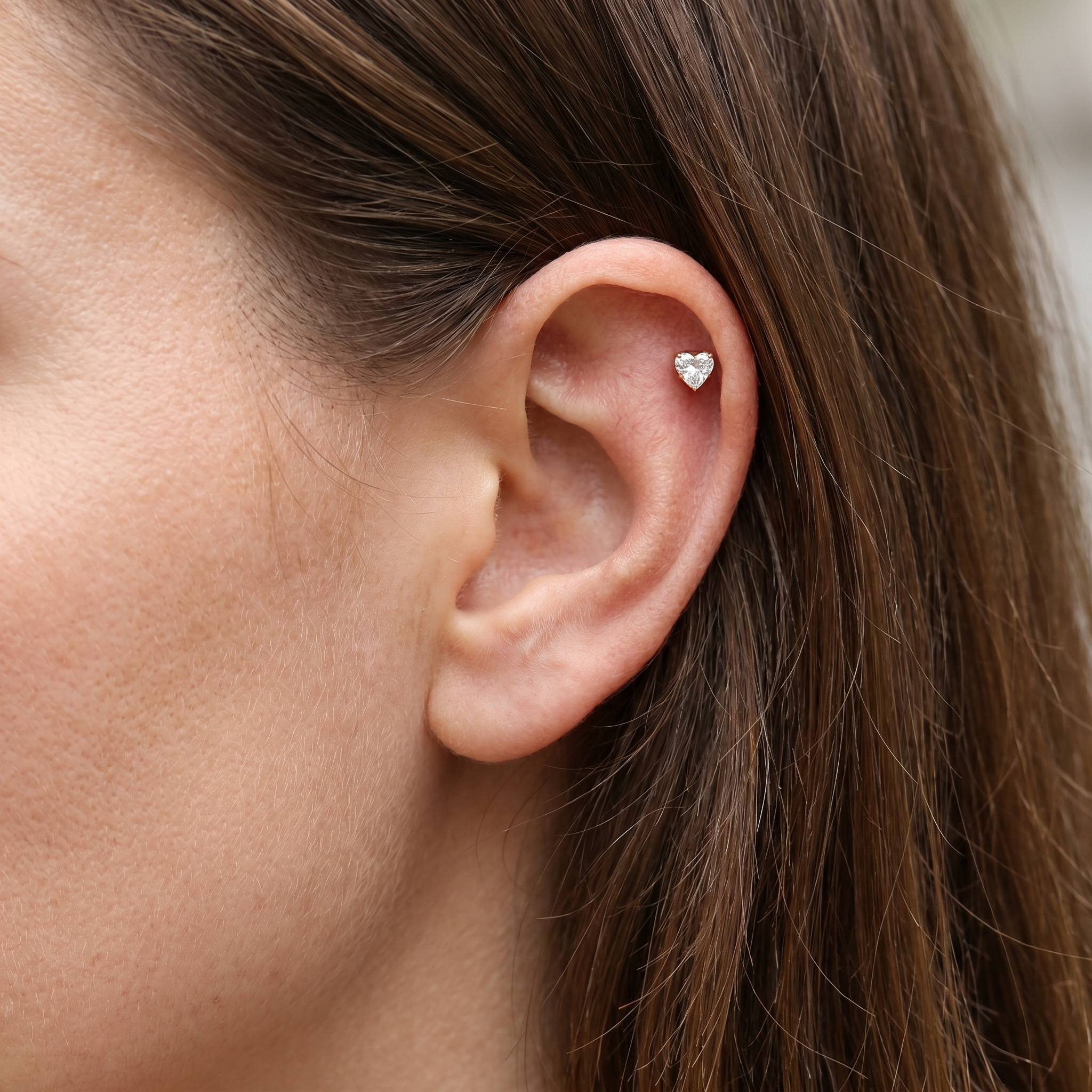 Gold heart zircon stud — helix jewelry placement