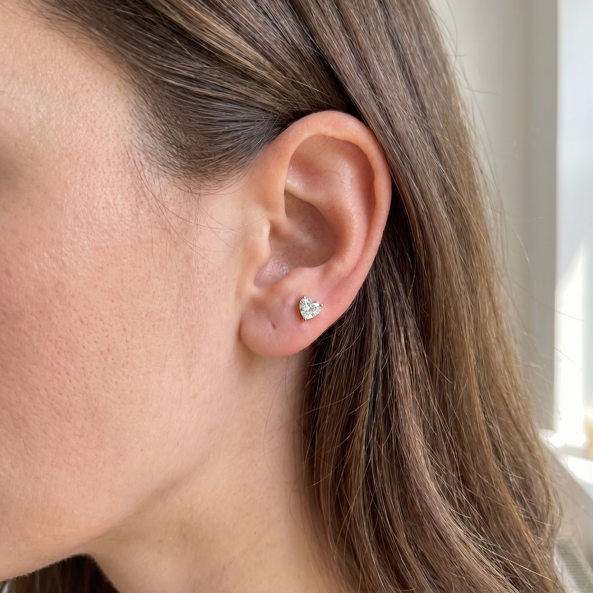 Gold heart zircon vertical stud — anti tragus placement