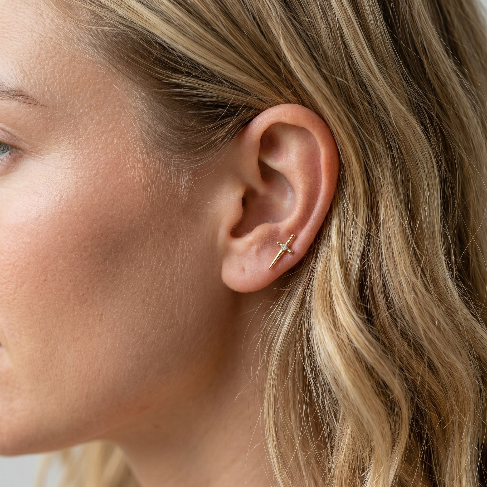 Gold dagger zircon helix stud — anti tragus placement