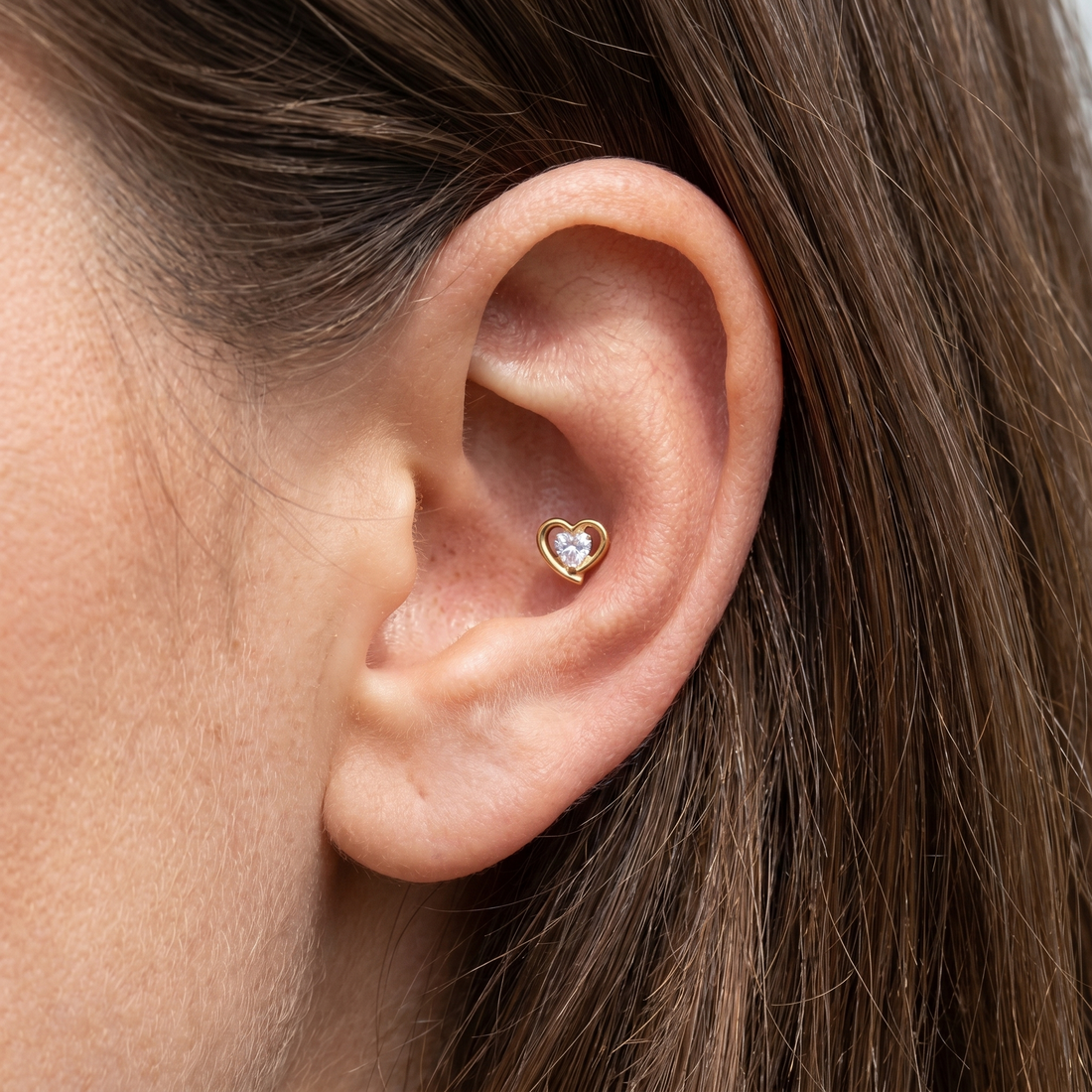Gold double heart zircon stud — outer conch piercing placement