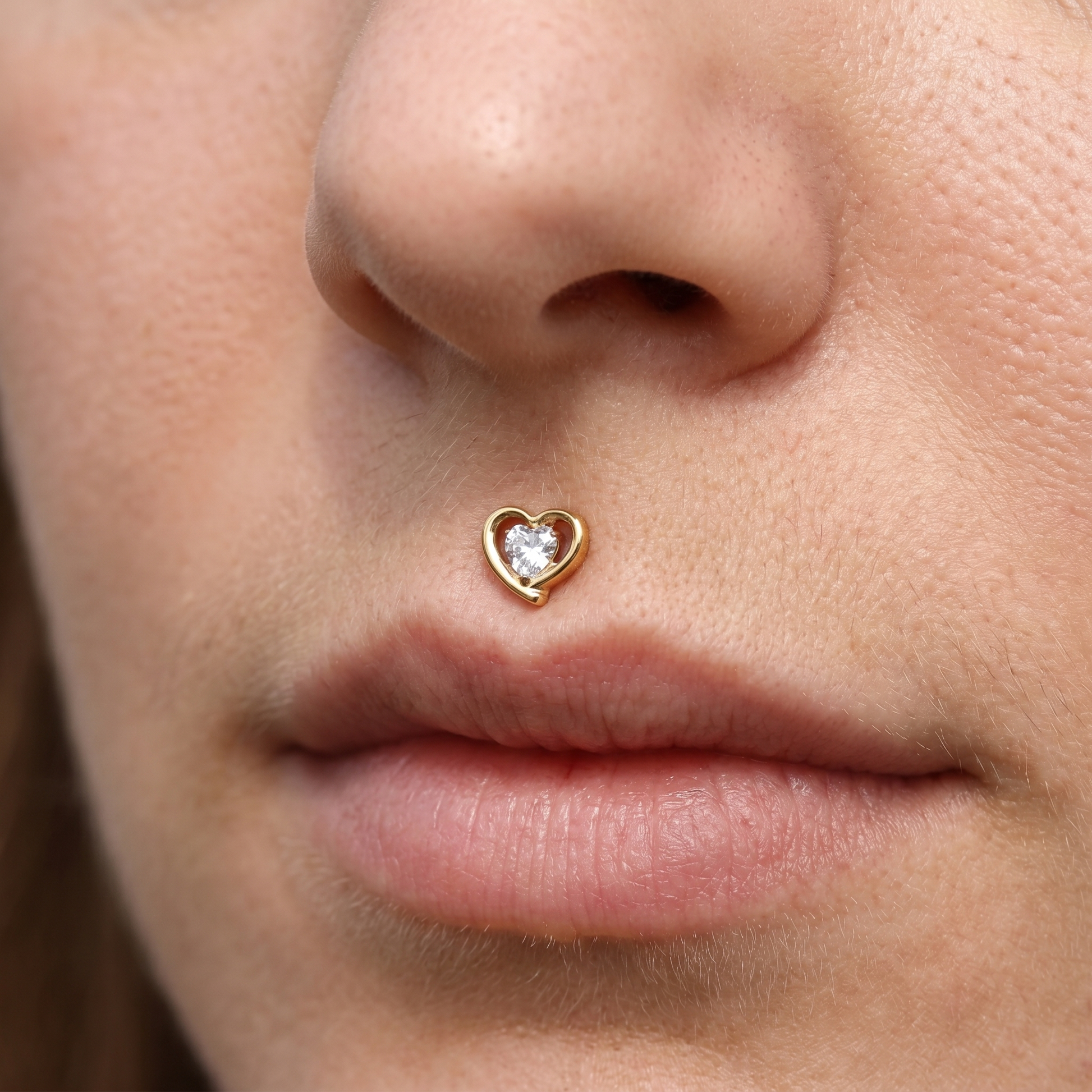 Gold double heart zircon stud — medusa piercing placement