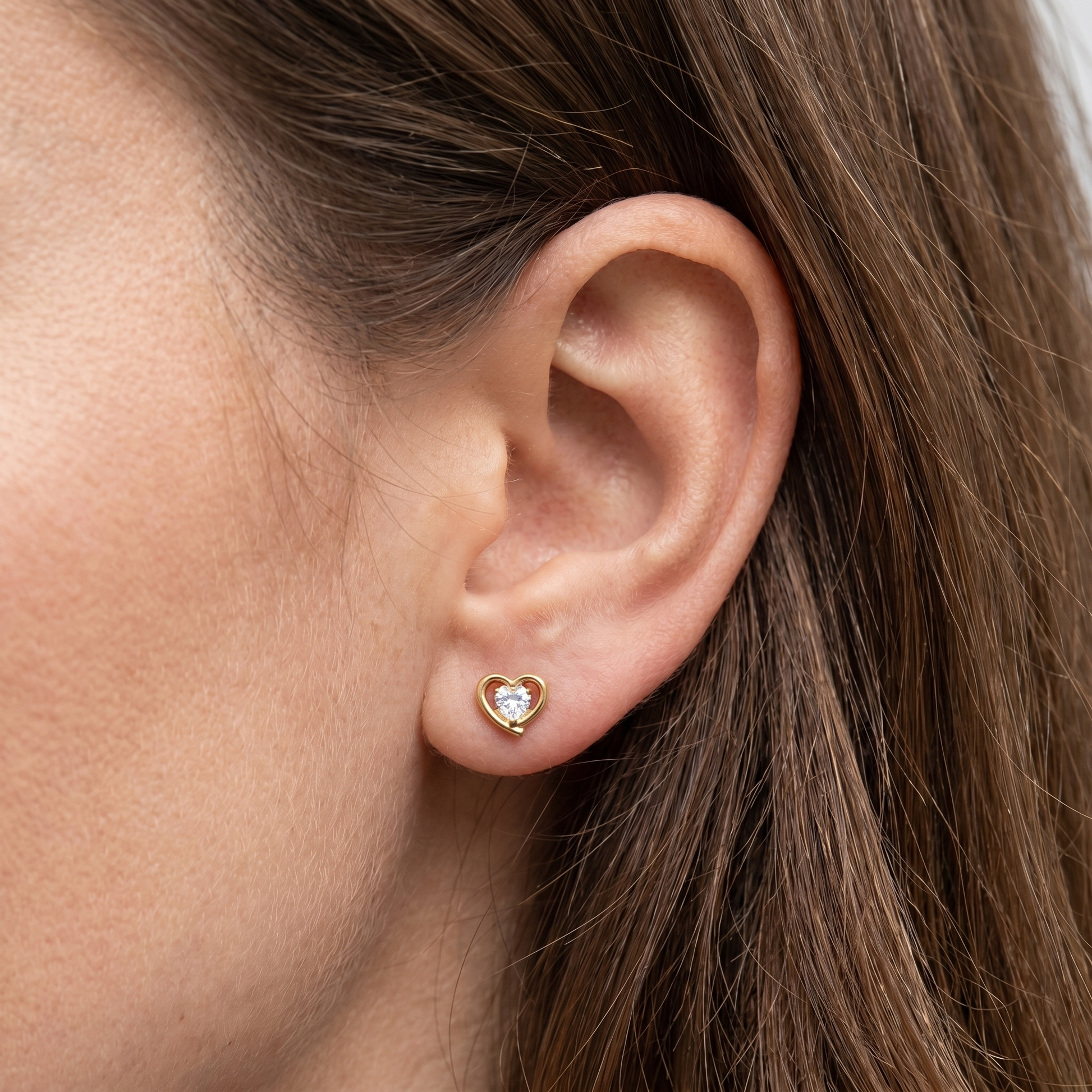 Gold titanium earring worn elegantly in a standard .