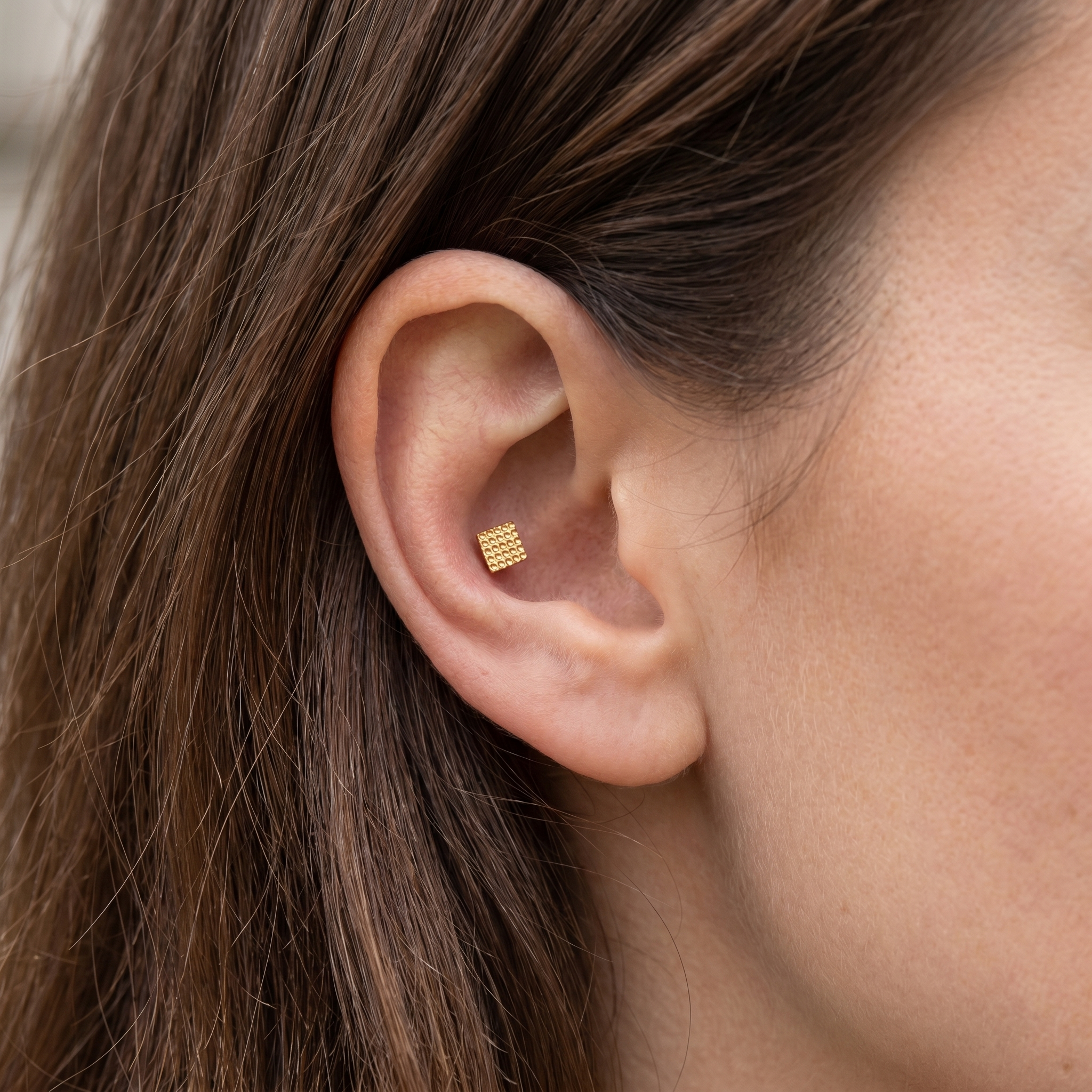 Gold geometric square grid stud — conch jewelry placement