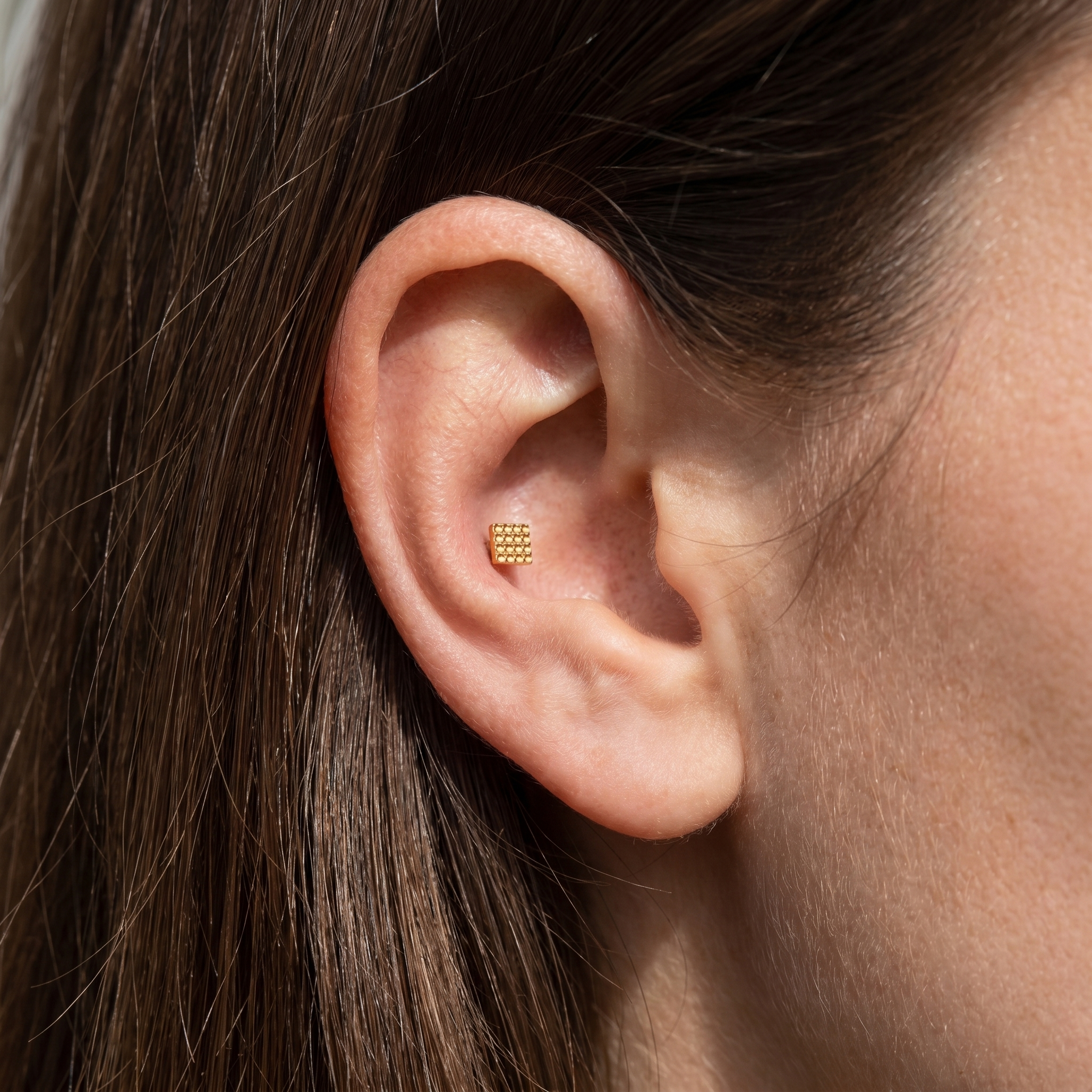 Silver geometric square grid stud — outer conch piercing placement