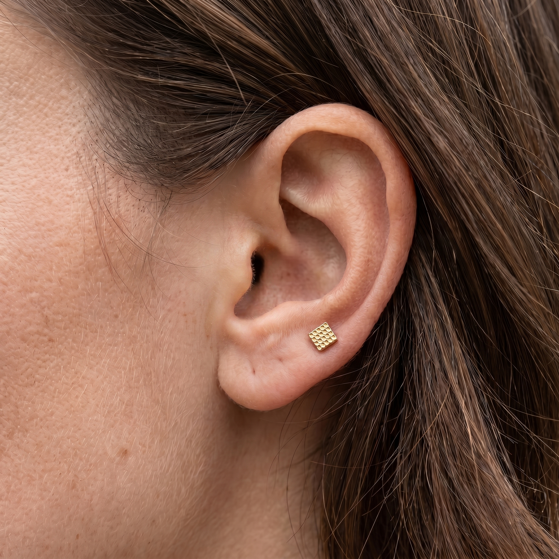 Gold geometric square grid stud — anti tragus placement