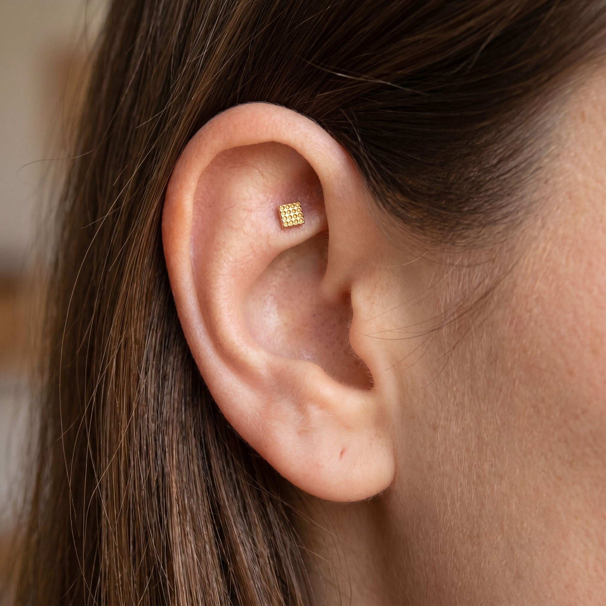Gold geometric square grid stud — faux rook piercing placement
