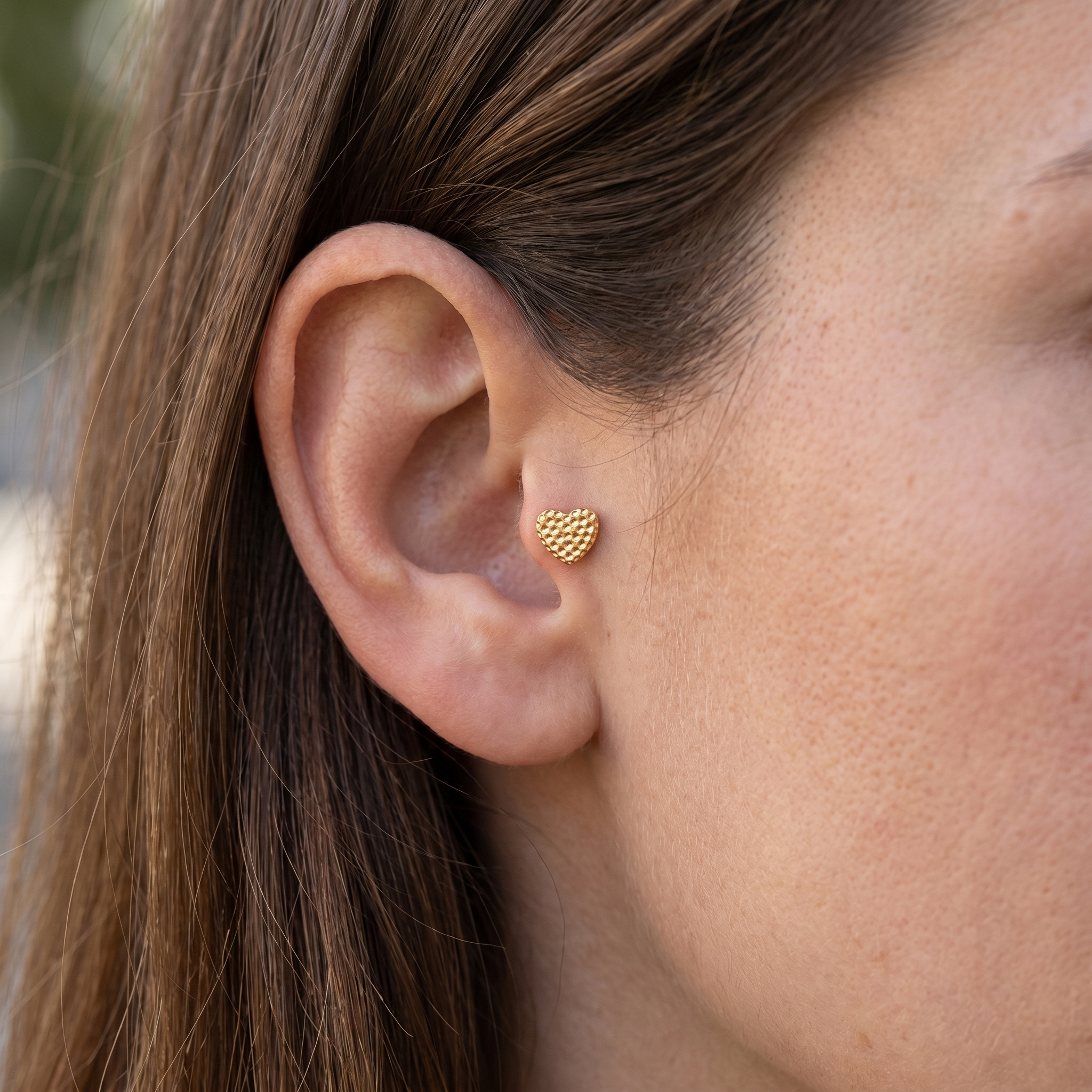 Gold textured heart stud — tragus jewelry placement